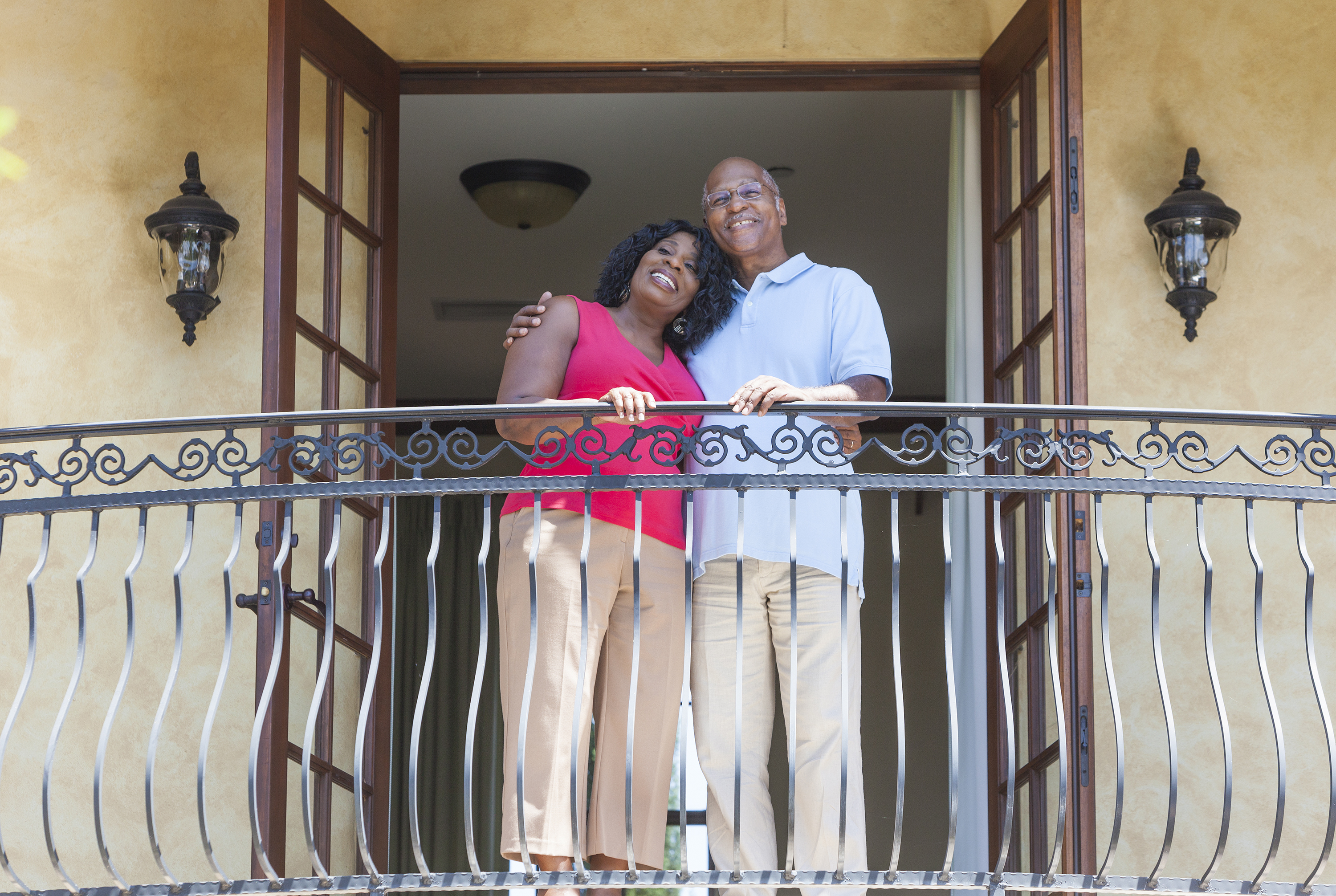 Senior African American Man & Woman Couple on Balcony