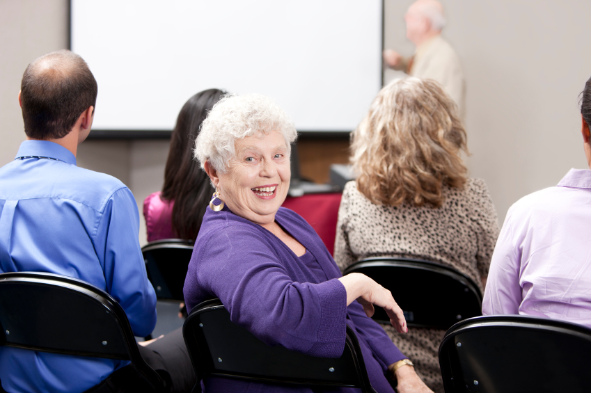 Real People:  Senior Adult Business Woman Presentation Small Gro