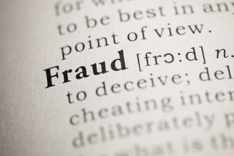 A piece of a dictionary page with focus on the word fraud 