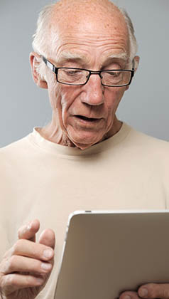 Senior Man with Tablet Computer