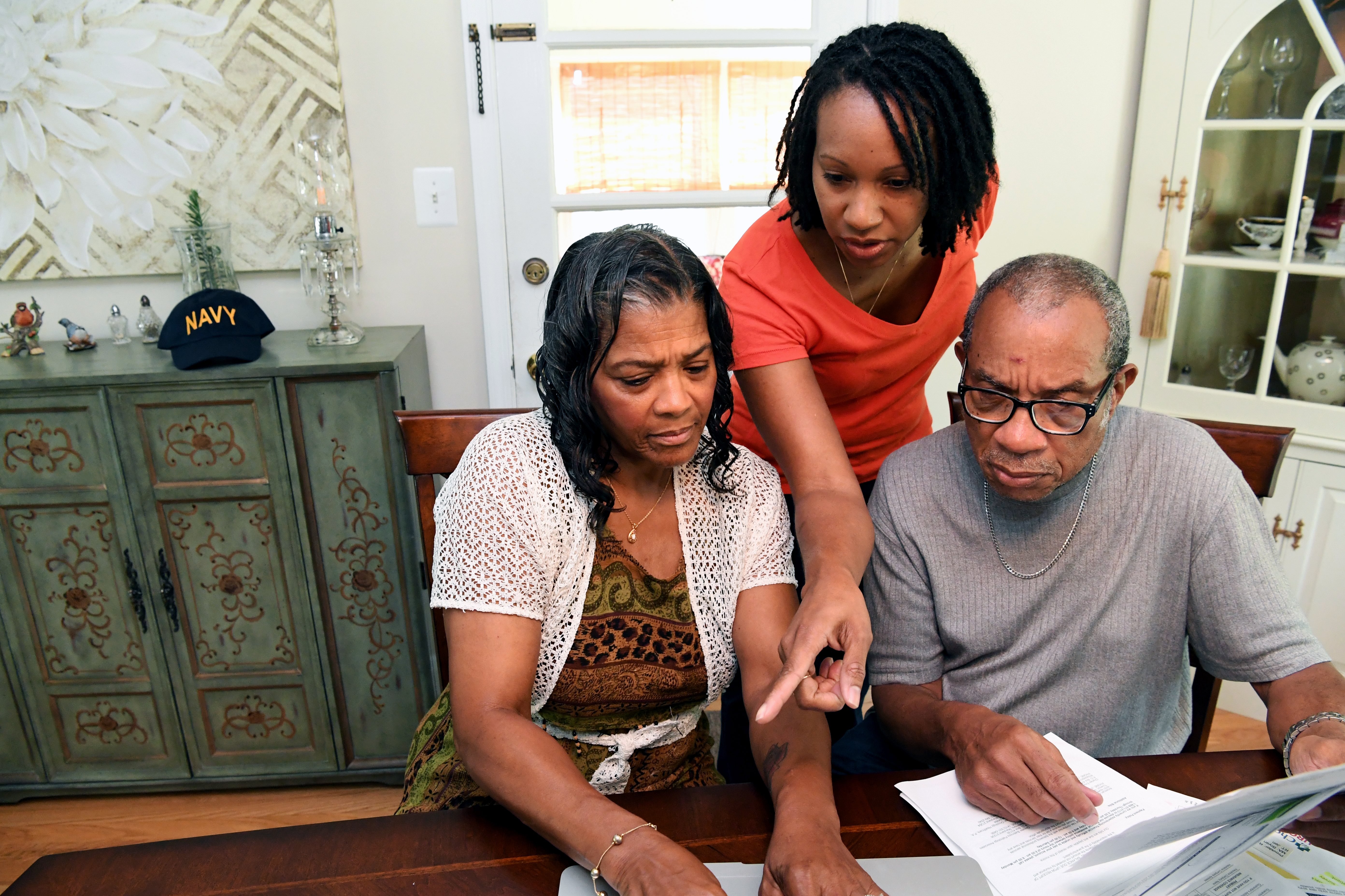 Family looking at documents.