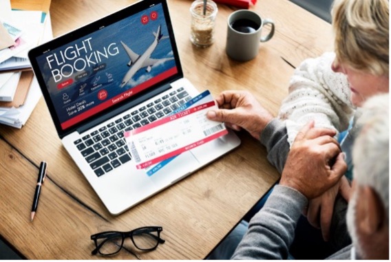 Laptop open to travel booking website