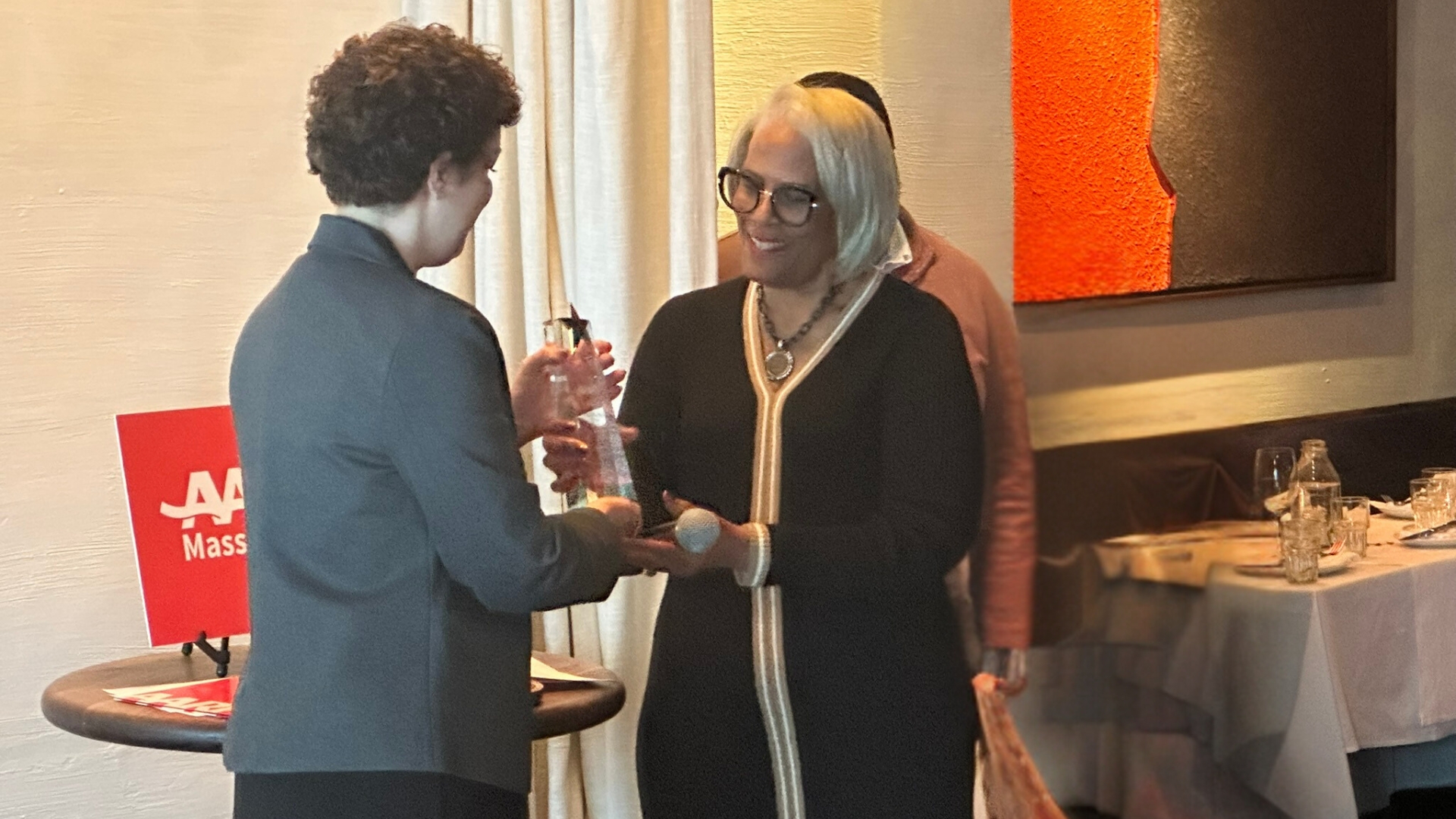 Sandra Harris accepts the 2024 AARP Massachusetts Andrus Award at Barcelona Wine Bar in November November 1 