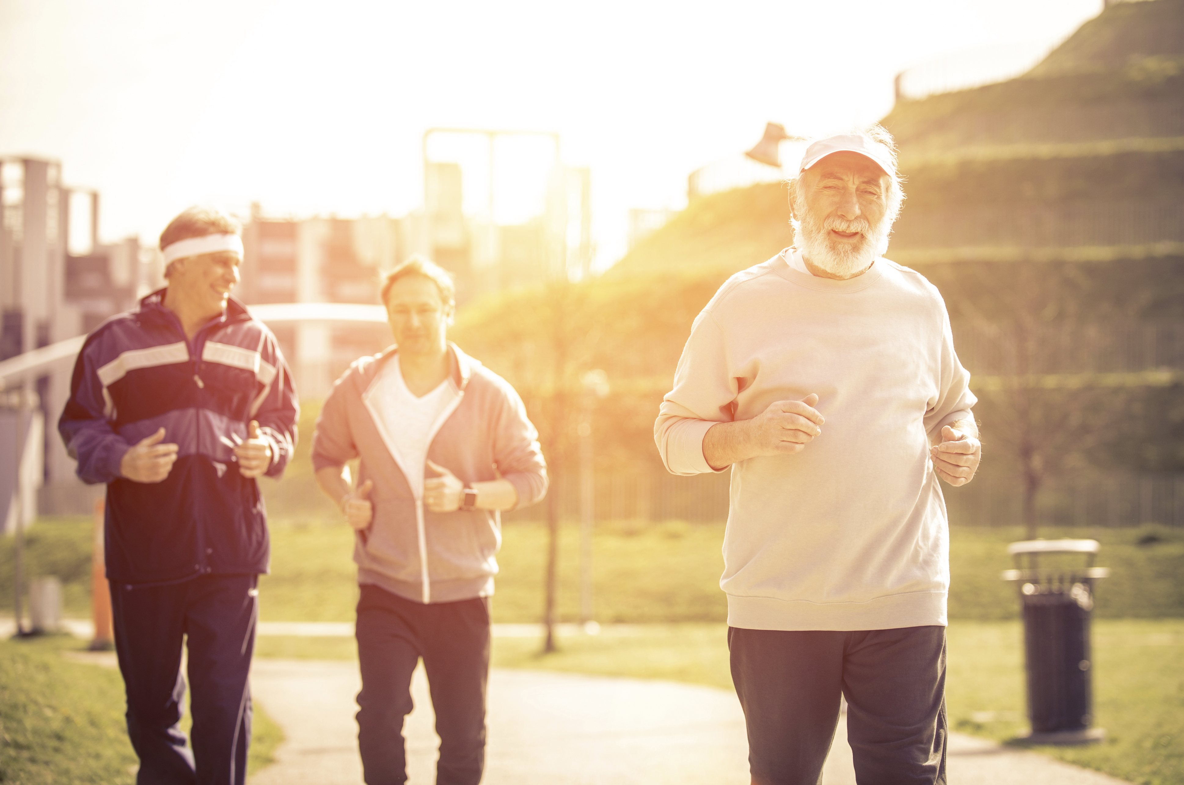 Group of seniors making jogging at the park