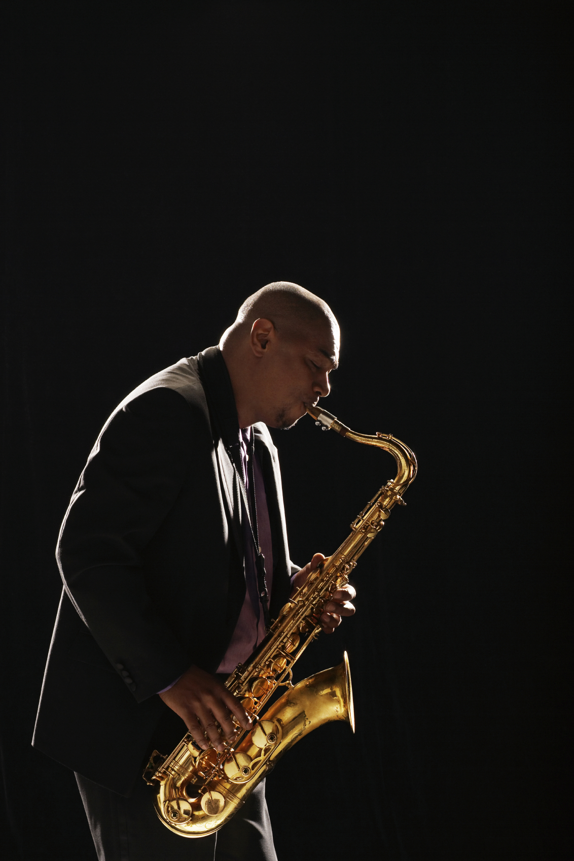 Side View Of Man Playing Saxophone