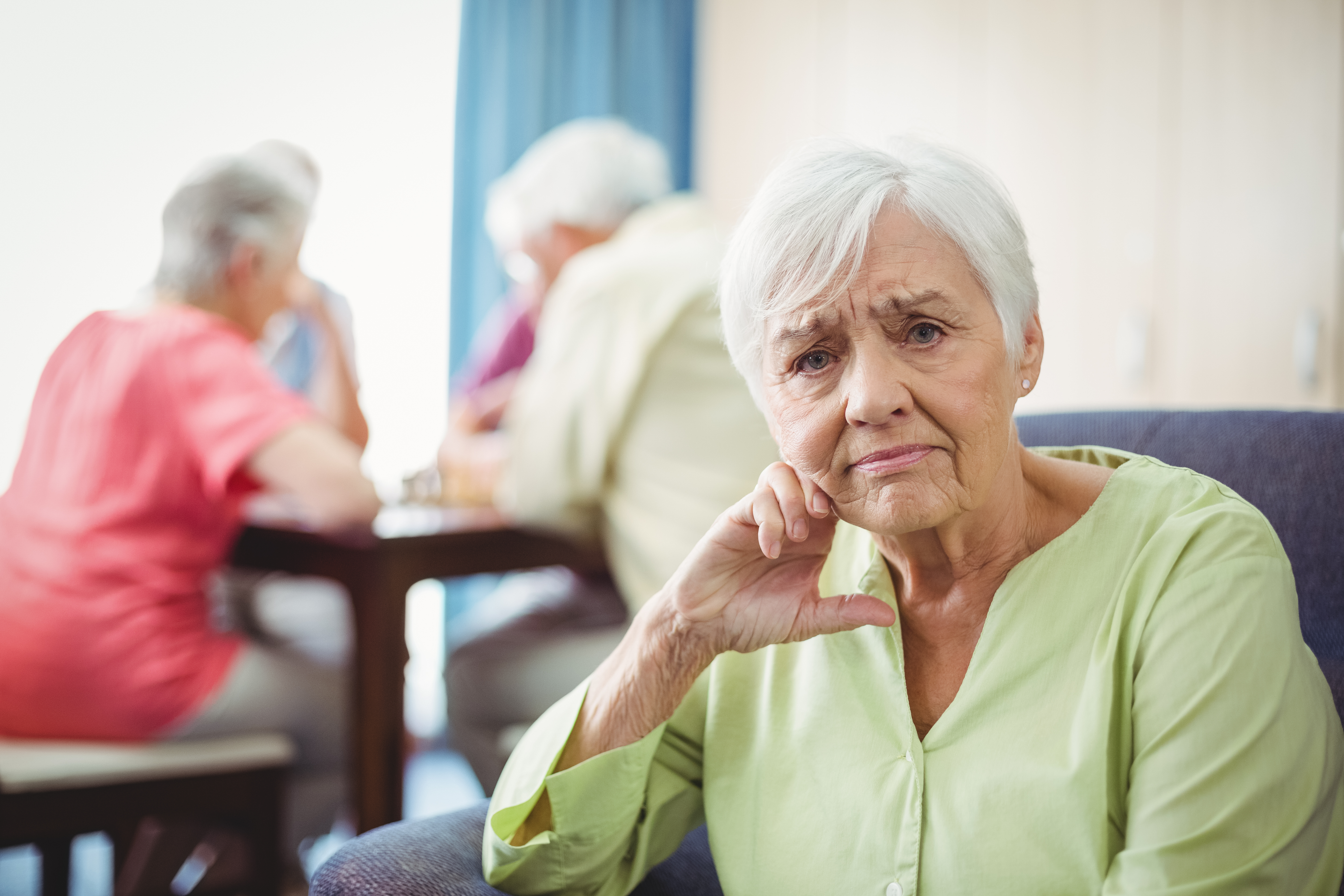 Senior woman sitting on a couch