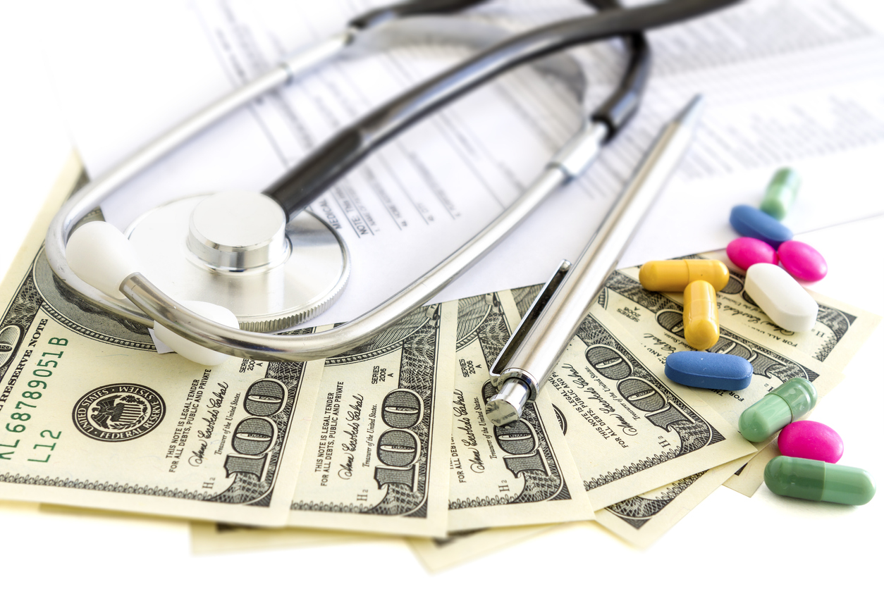 Money, stethoscope and pills, medical insurance