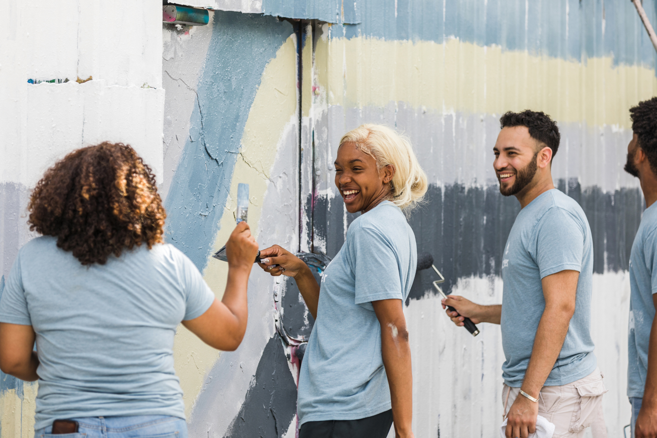 Young adults use their painting supplies