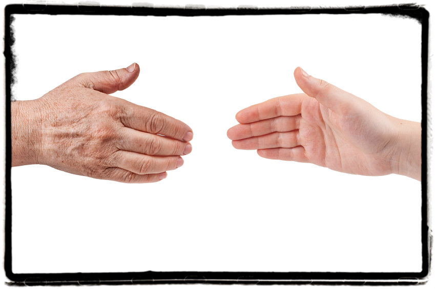 Old hand reaching to young hand_border added__denisovd_499,998