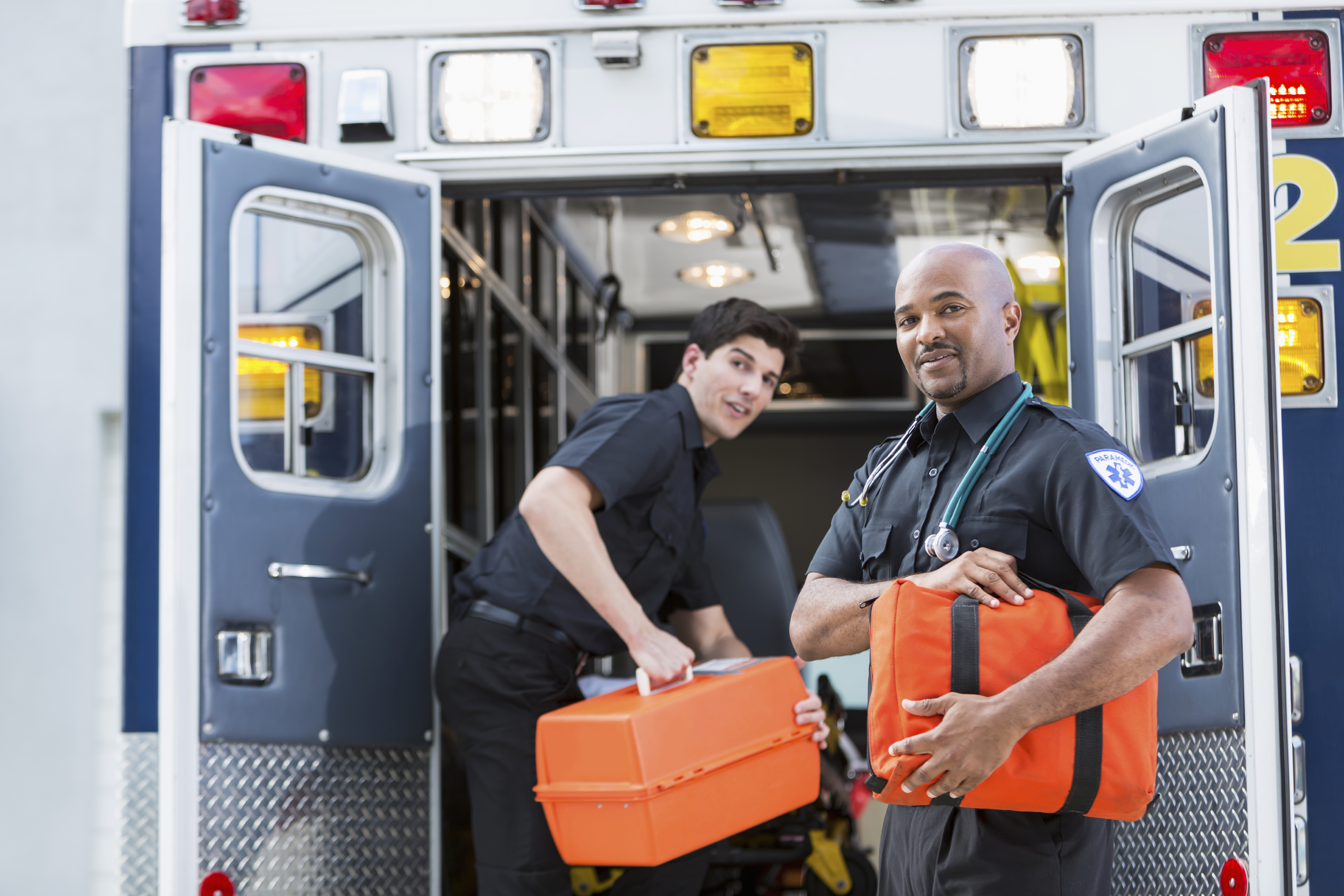 Paramedics at back of ambulance