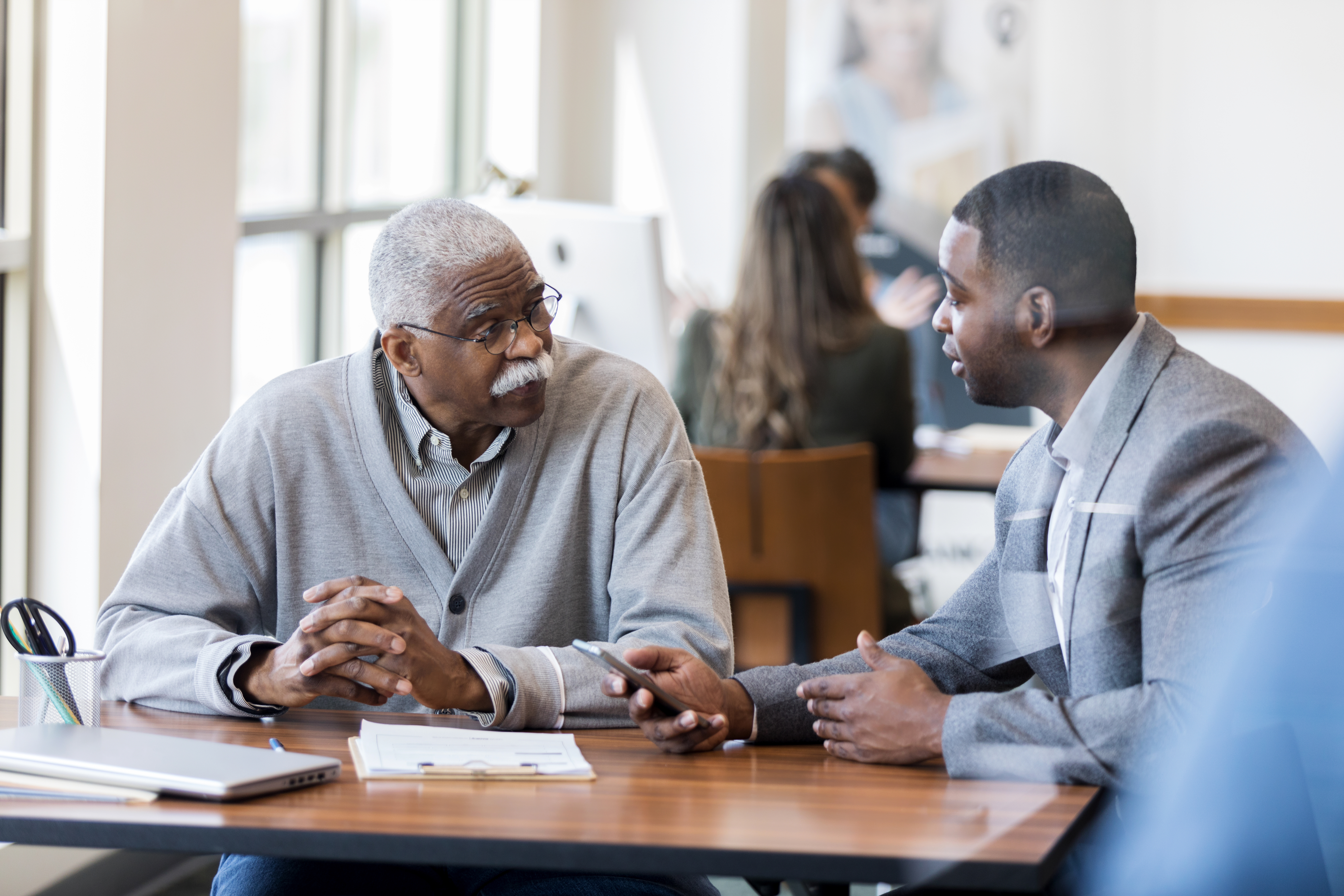 African American bank manager explains mortgage terms