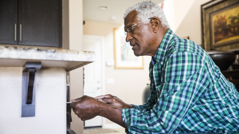 Picture of an individual making home modifications