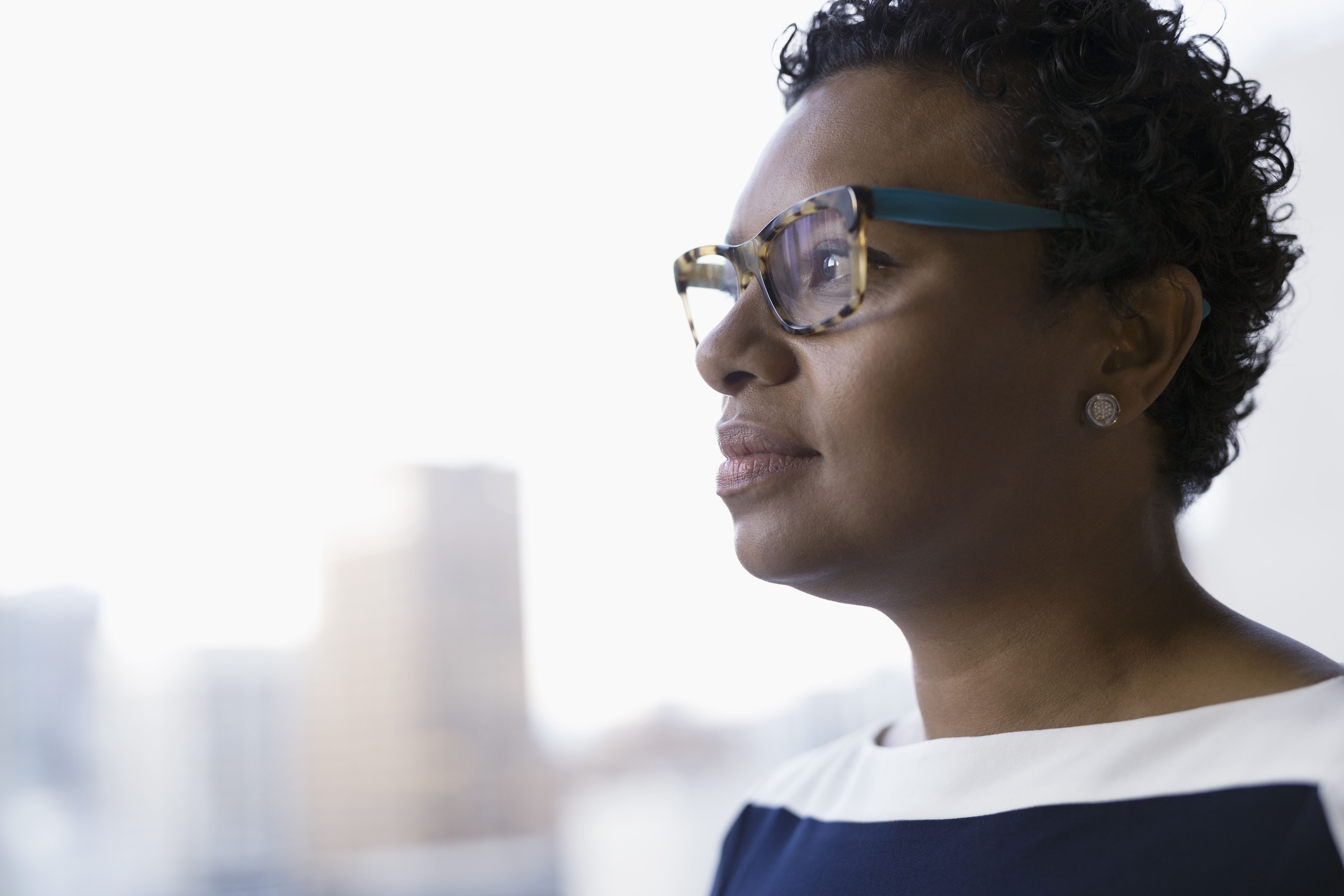 Close up pensive businesswoman looking away