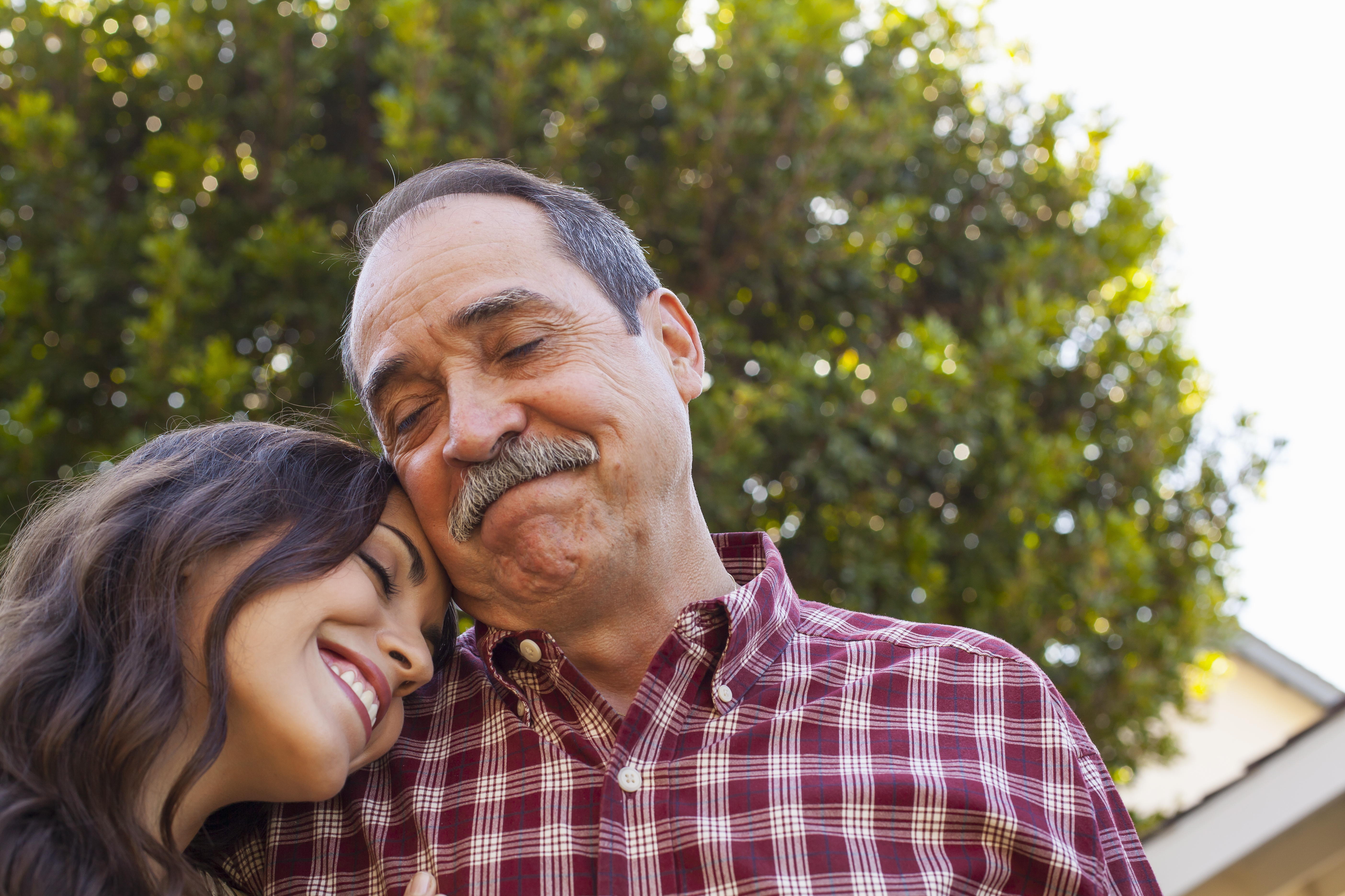 Father and daughter sharing tender moment