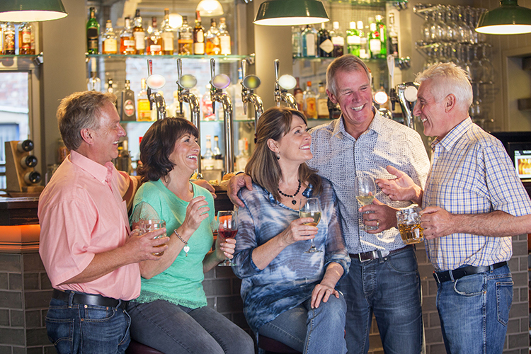 Happy Senior Friends in a Pub