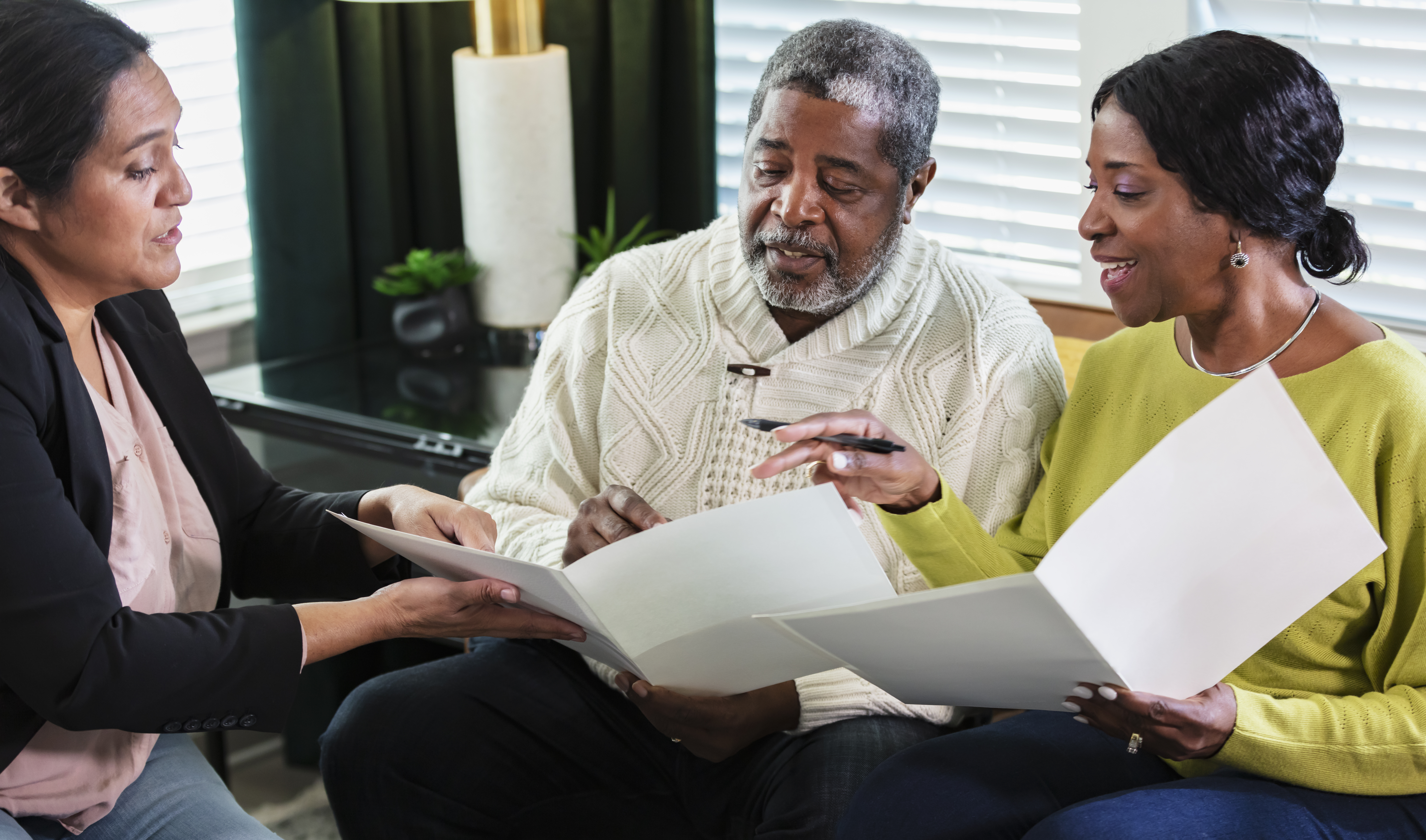Senior African-American couple with in home advisor