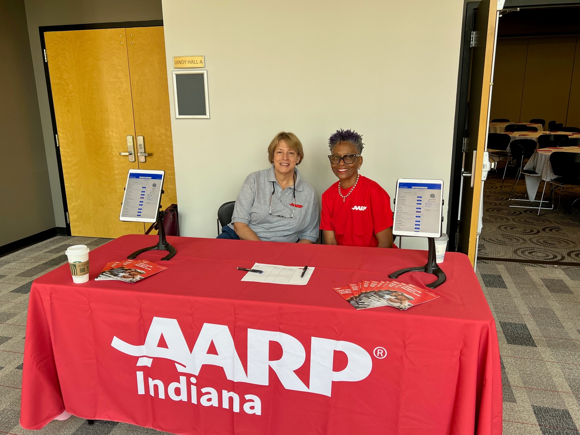 AARP Indiana volunteers Wanda Kiesler and Allyson Strother get ready to check attendees in at the recent Longevity at Home event.