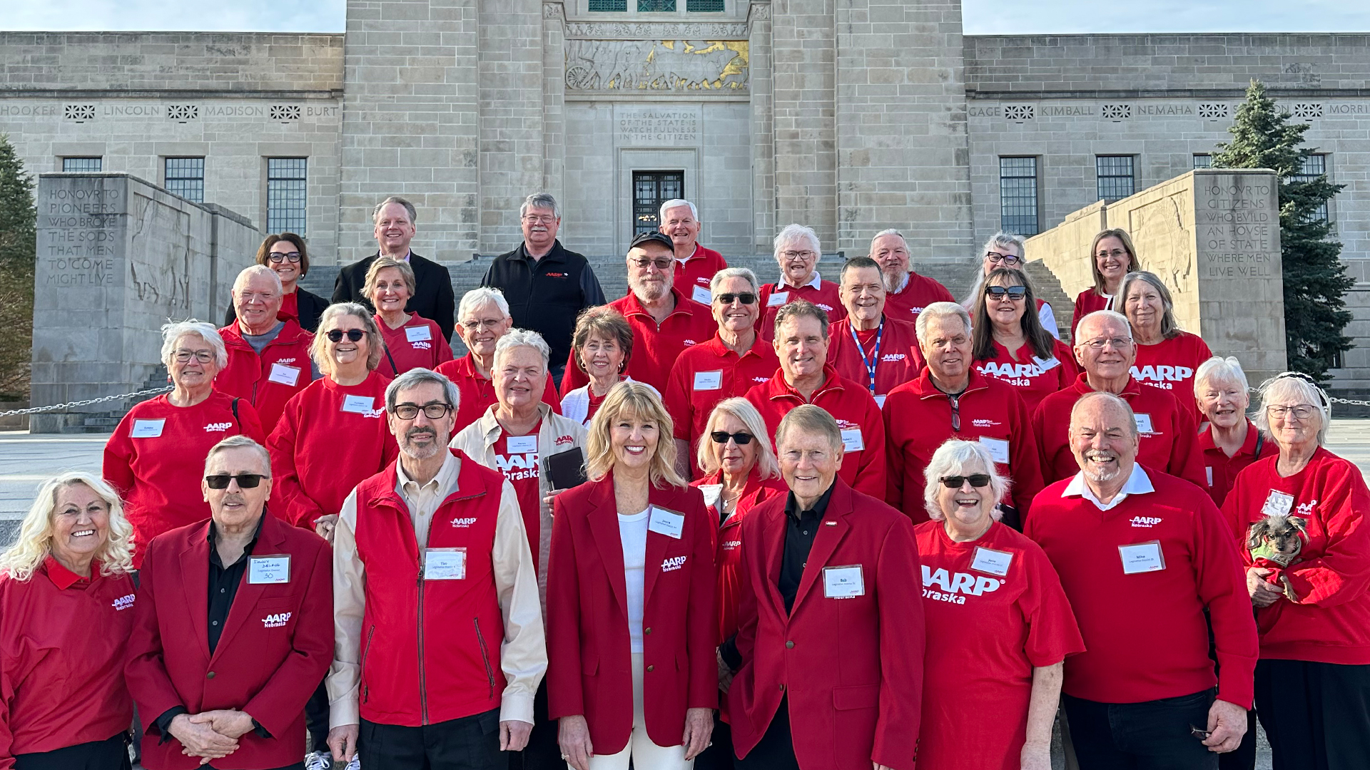 AARP Nebraska volunteers gather outside of the Nebraska state capitol for Lobby Week 2025. 