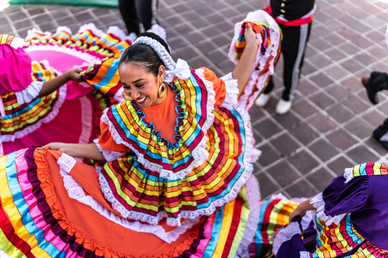 Mexican folkloric dancer in colorful dress