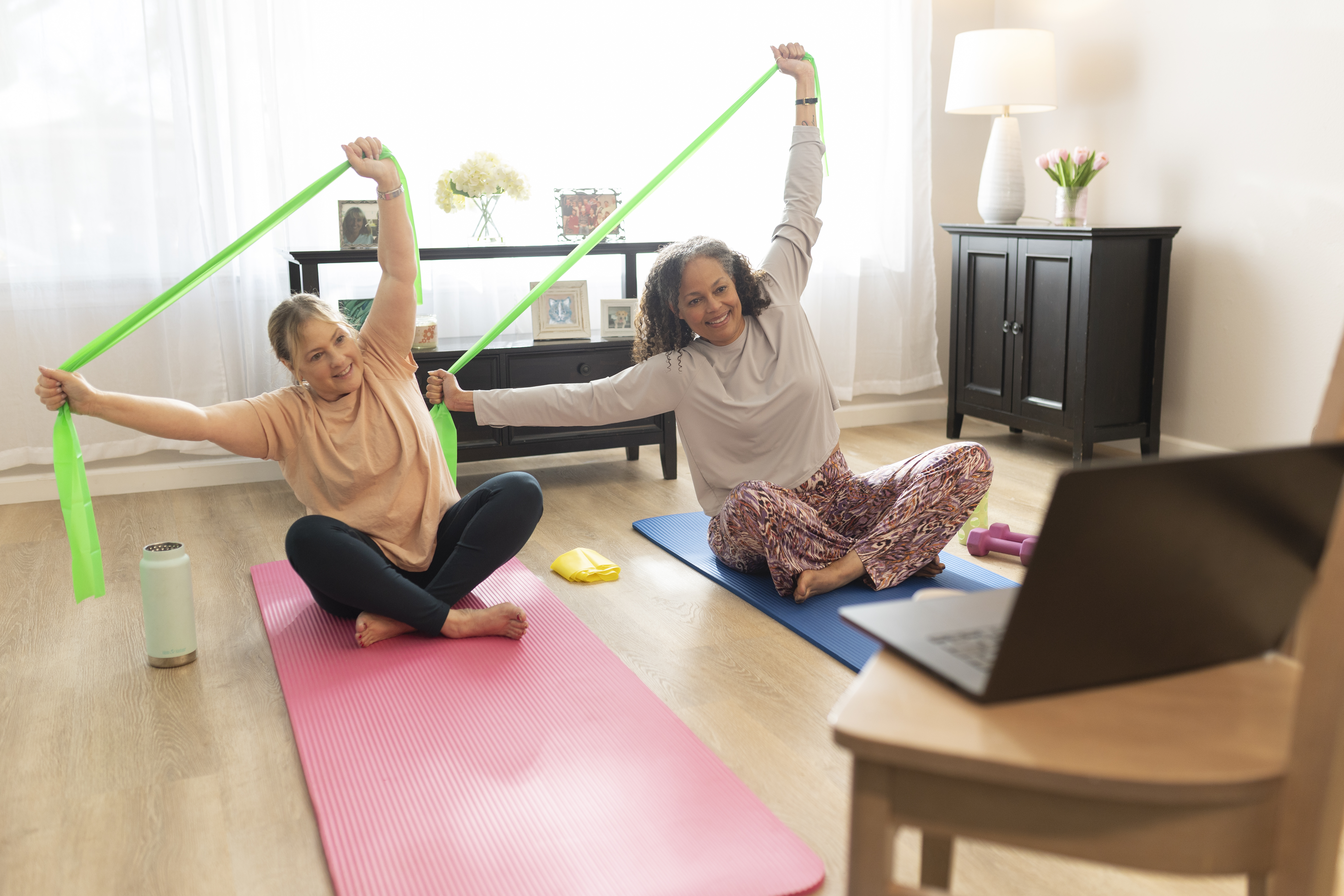 Two women doing strengthening exercises
