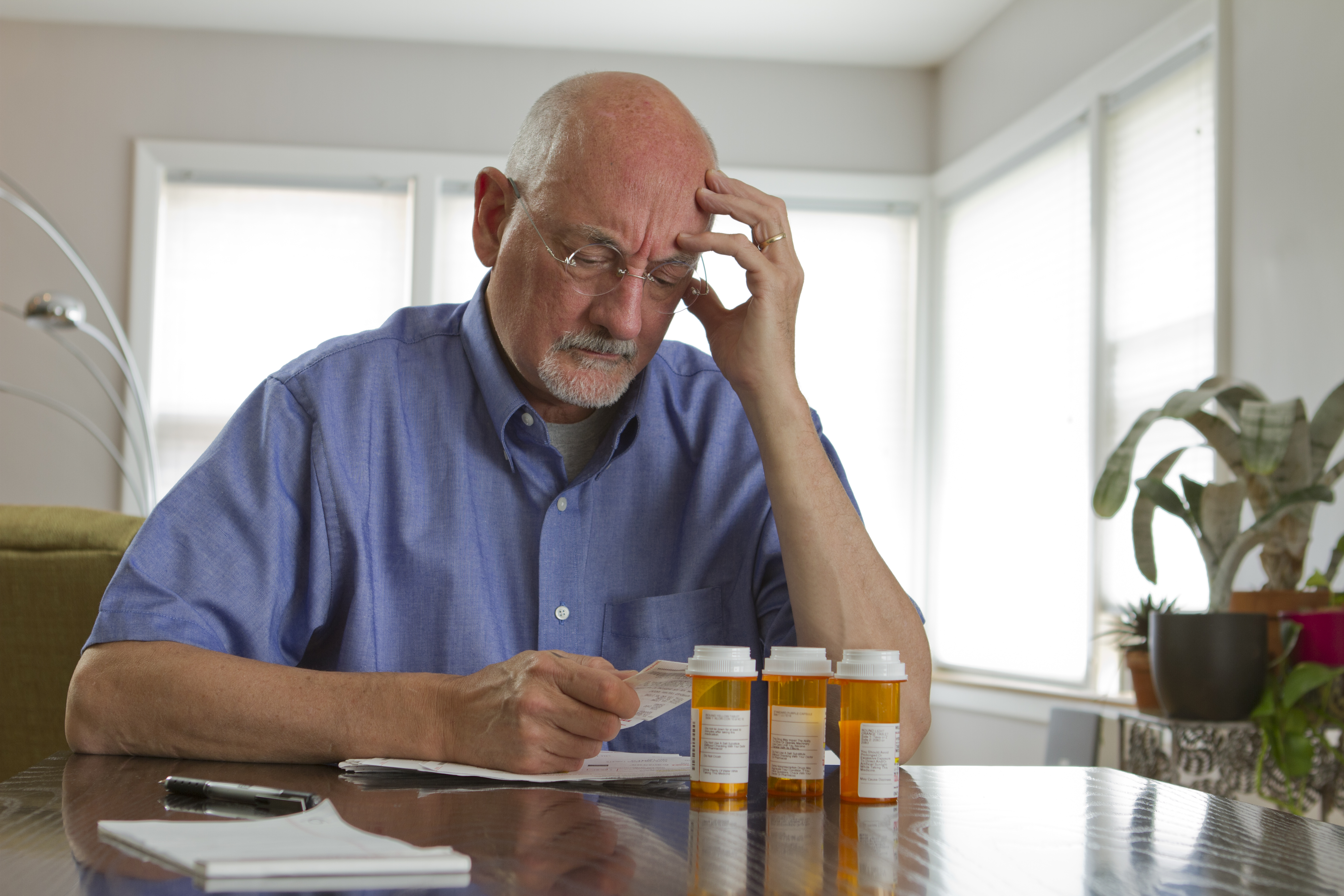 Older man with prescription medications