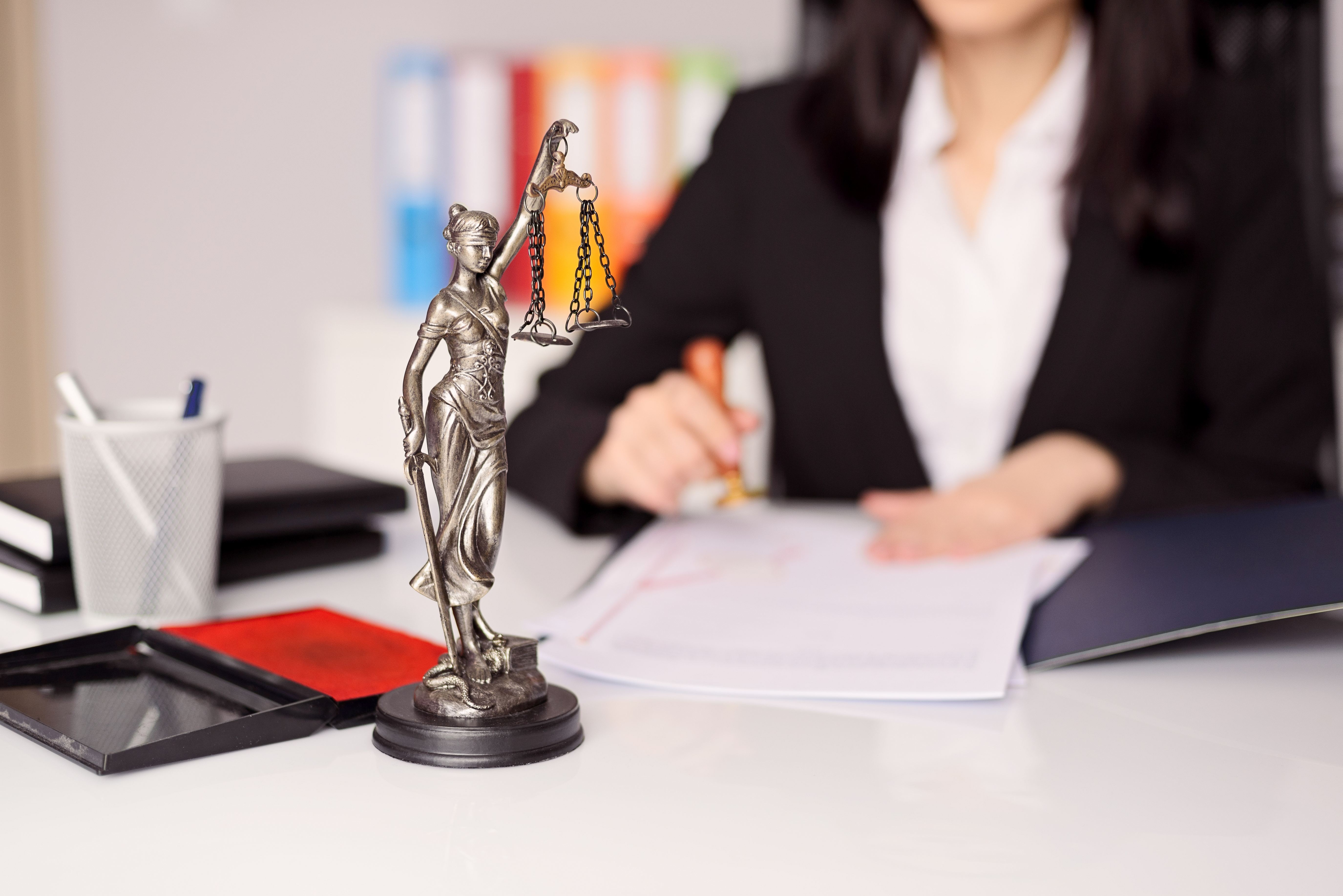 Statuette of Themis -  goddess of justice on lawyer's desk