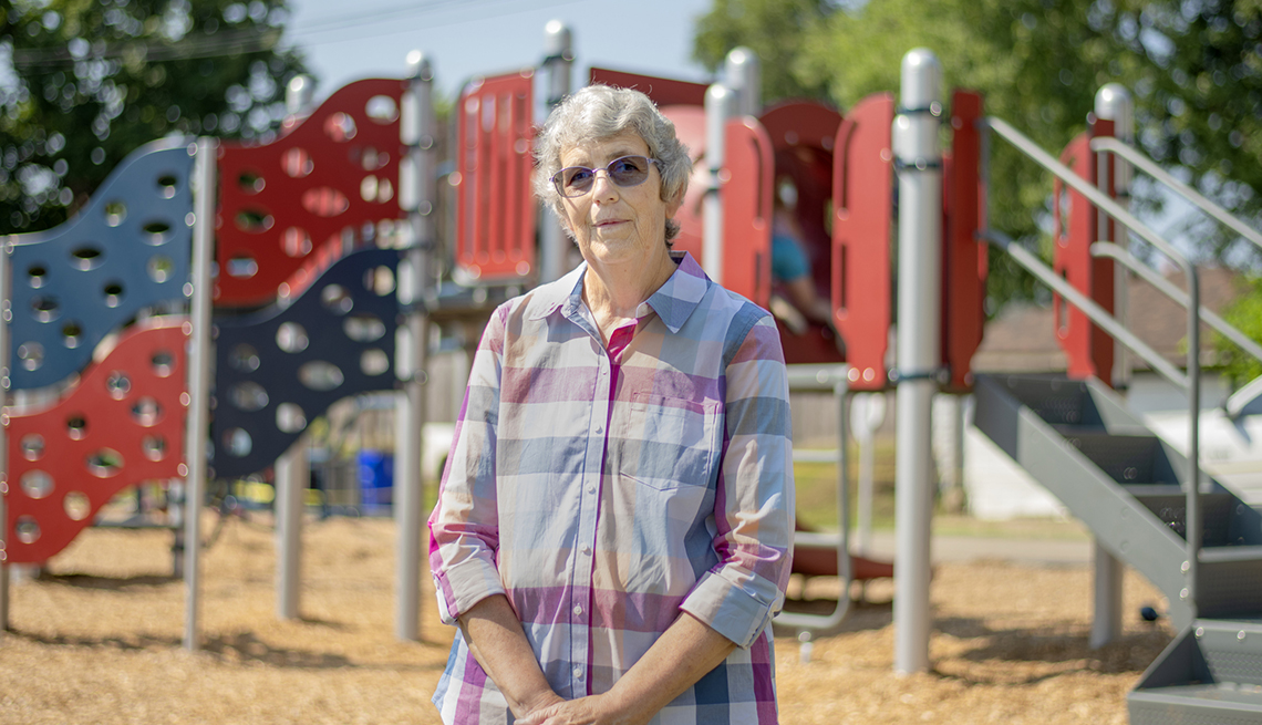 Pat Patrick of Chillicothe stands in front of a playground project on property she donated to the city of Chillicothe. AARP Community  Challenge grant helped to fund the project in 2023 