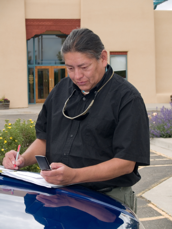 Native American man calling on cell phone