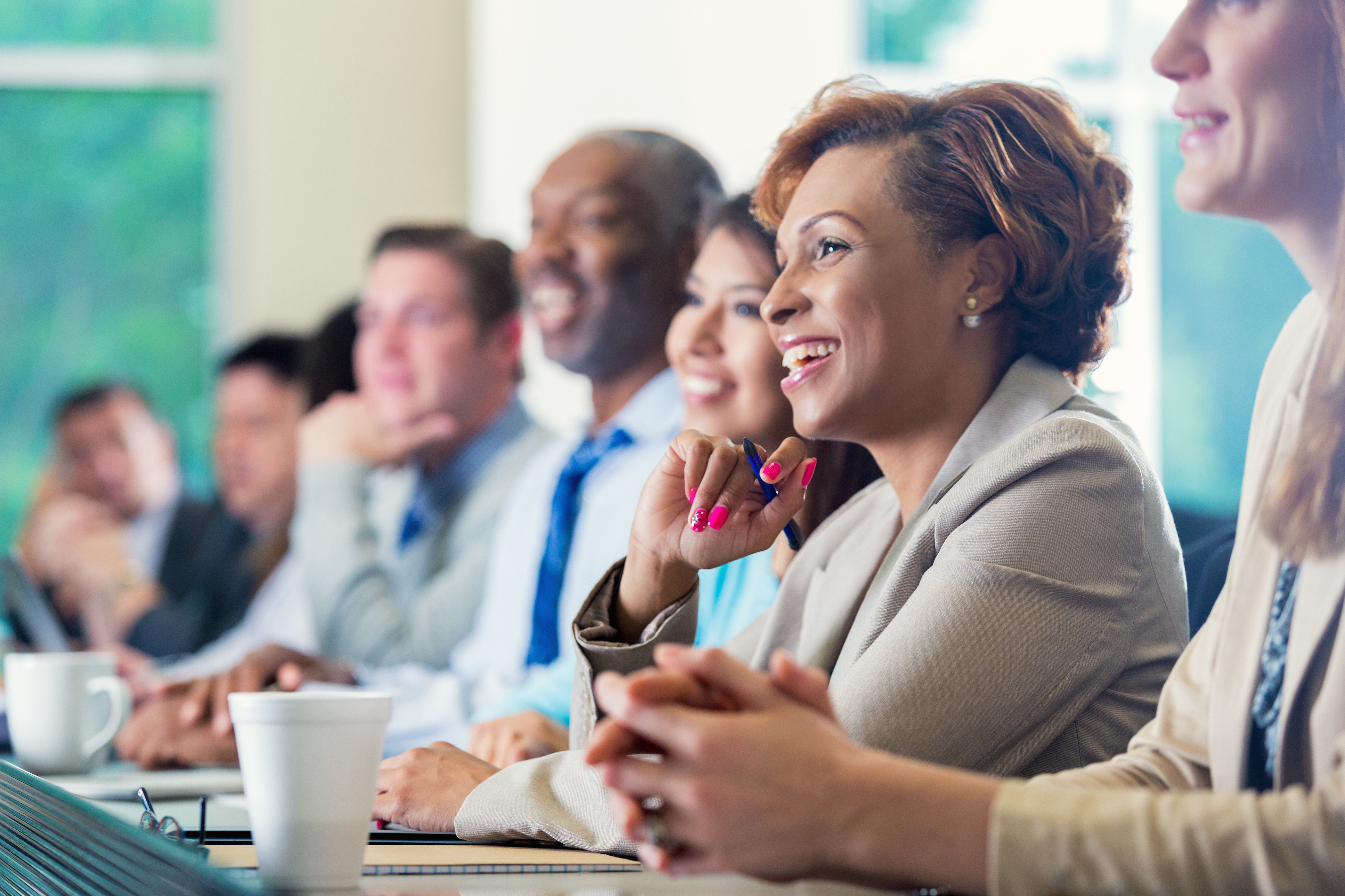 African American businesswoman attending seminar or job training business conference