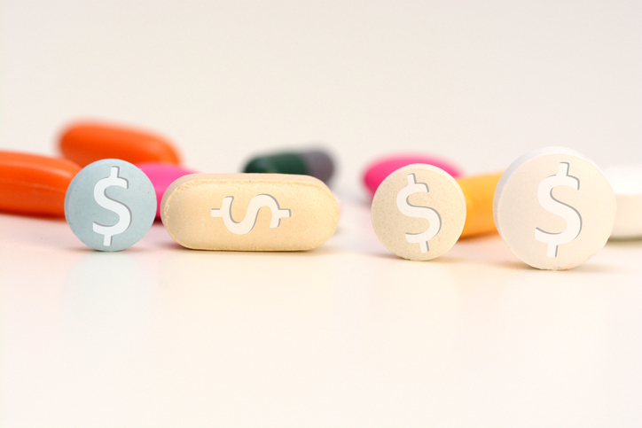 Health care cost concept with multicolored medical drugs