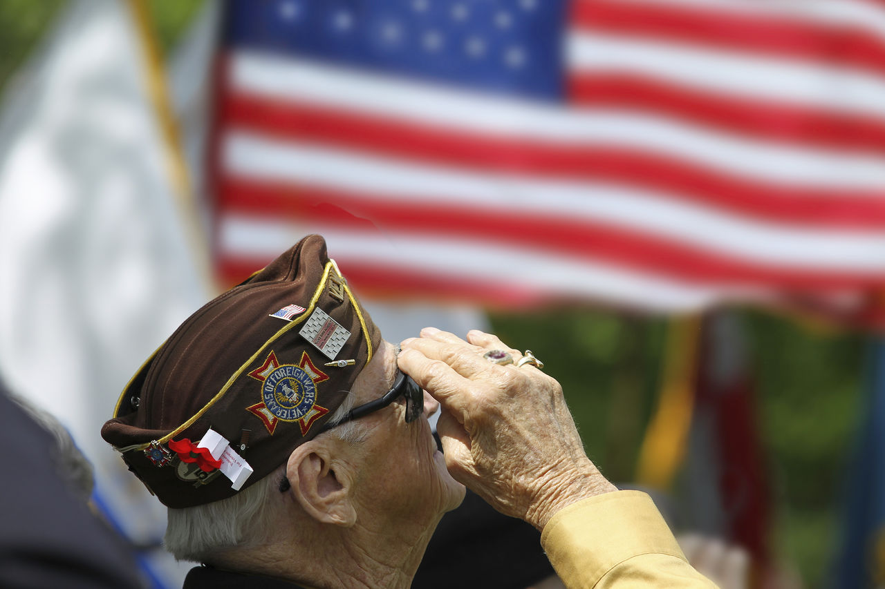 Veteran salutes flag .jpg