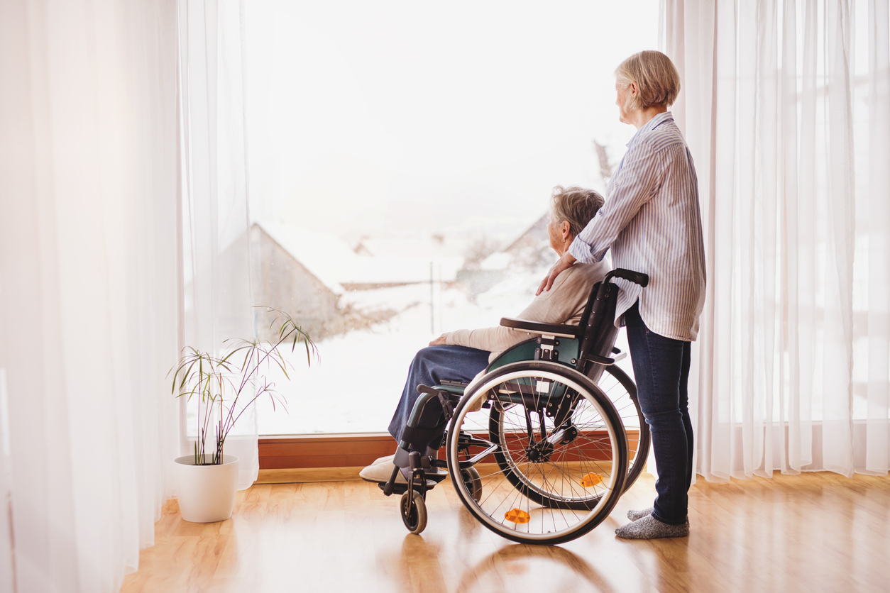 Senior women with wheelchair at home.
