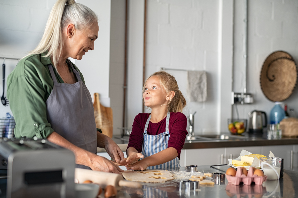 Grandmother and granddaughter cooking together