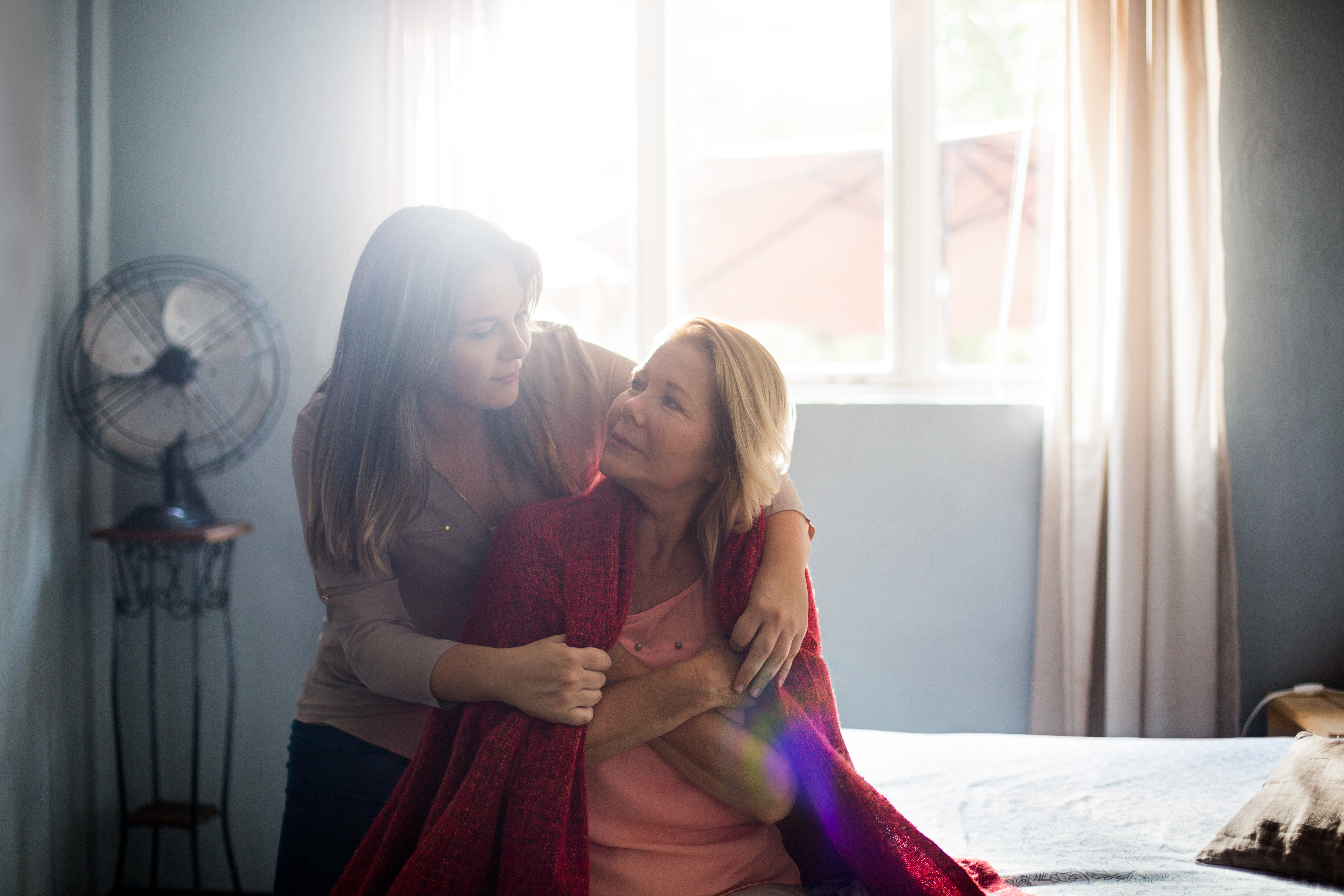 Loving daughter taking care of her mother