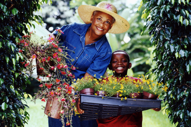 GRANDMOTHER WITH GRANDSON IN GARDEN