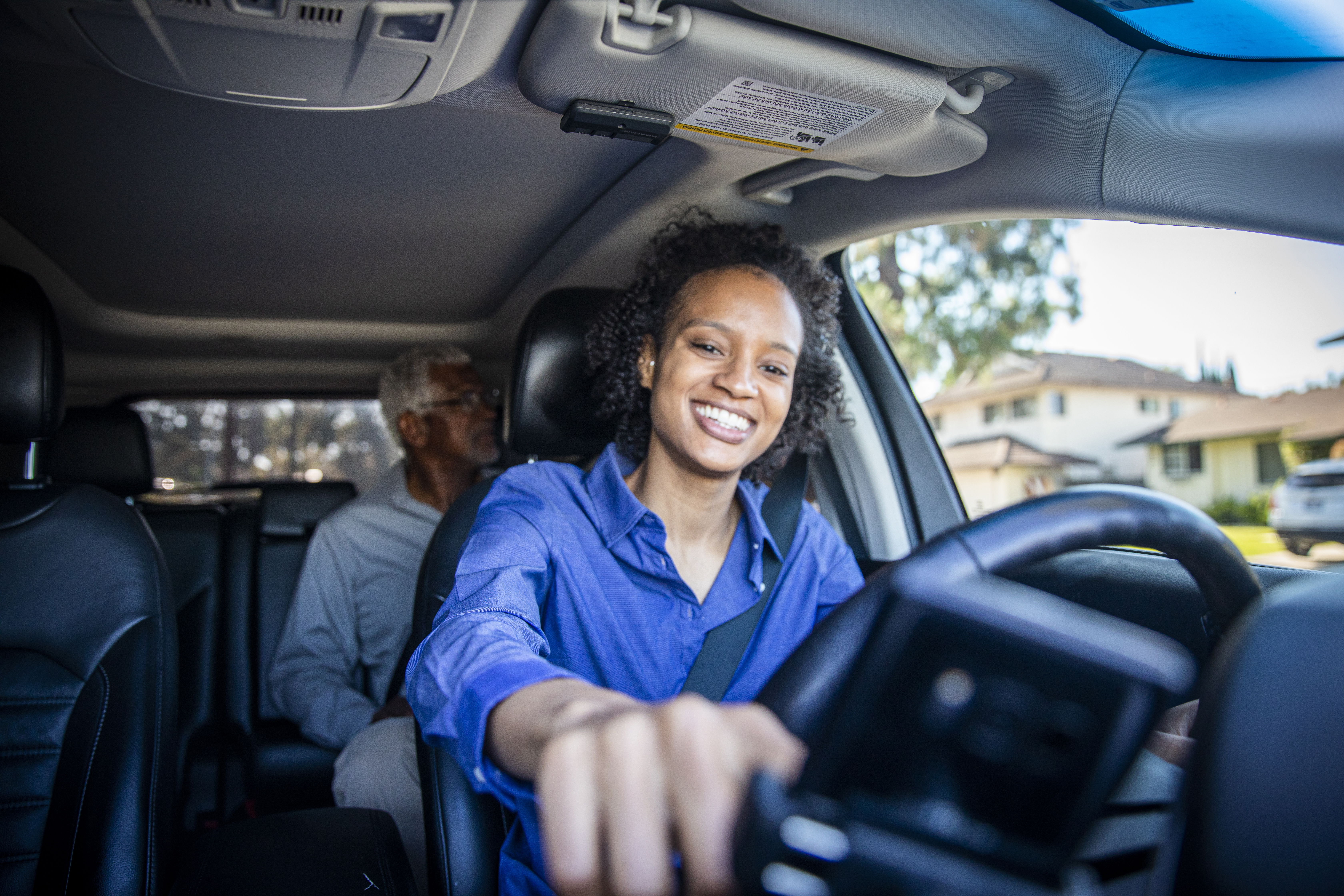 Young Black Woman Driving Car for Rideshare