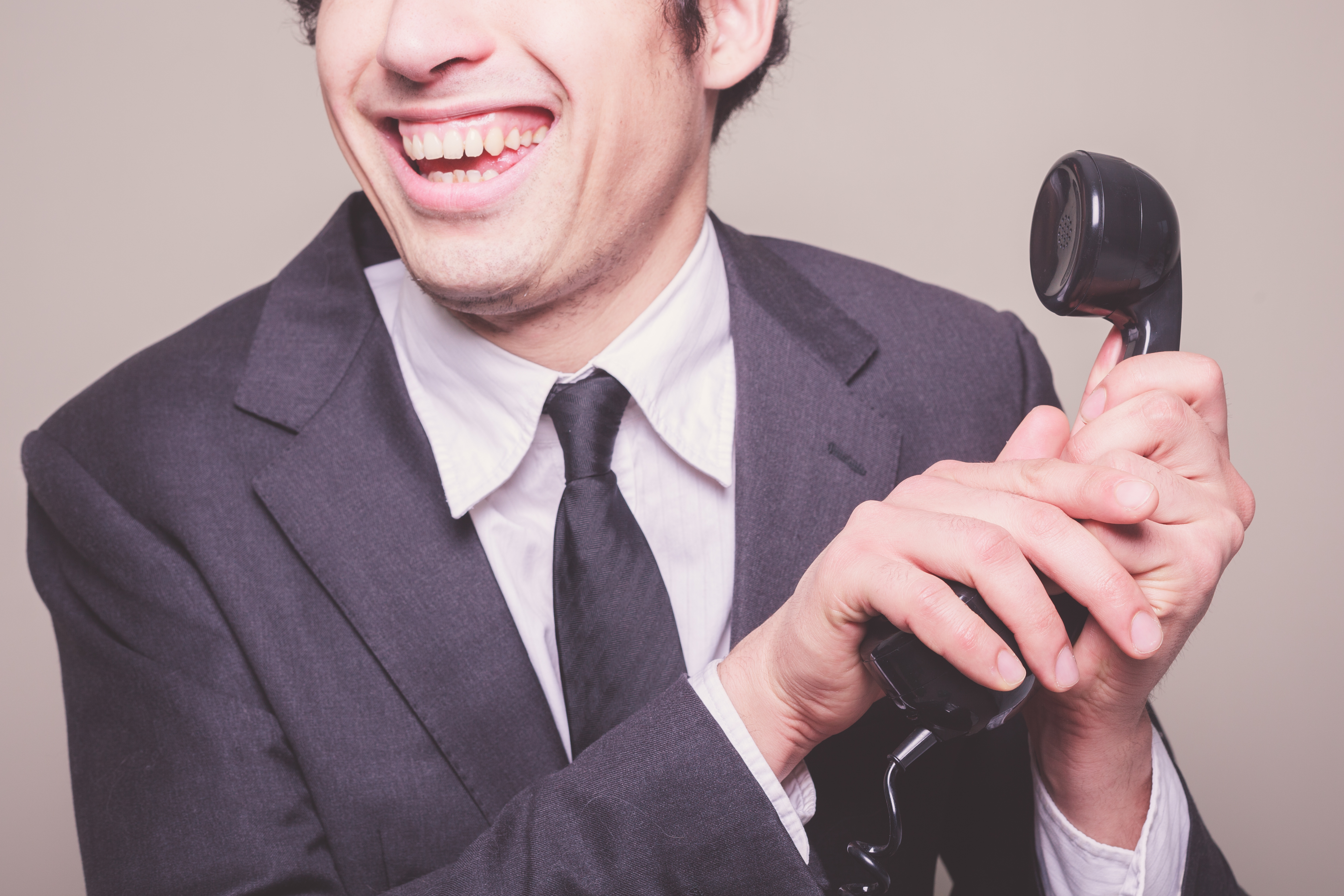 Happy businessman on the phone