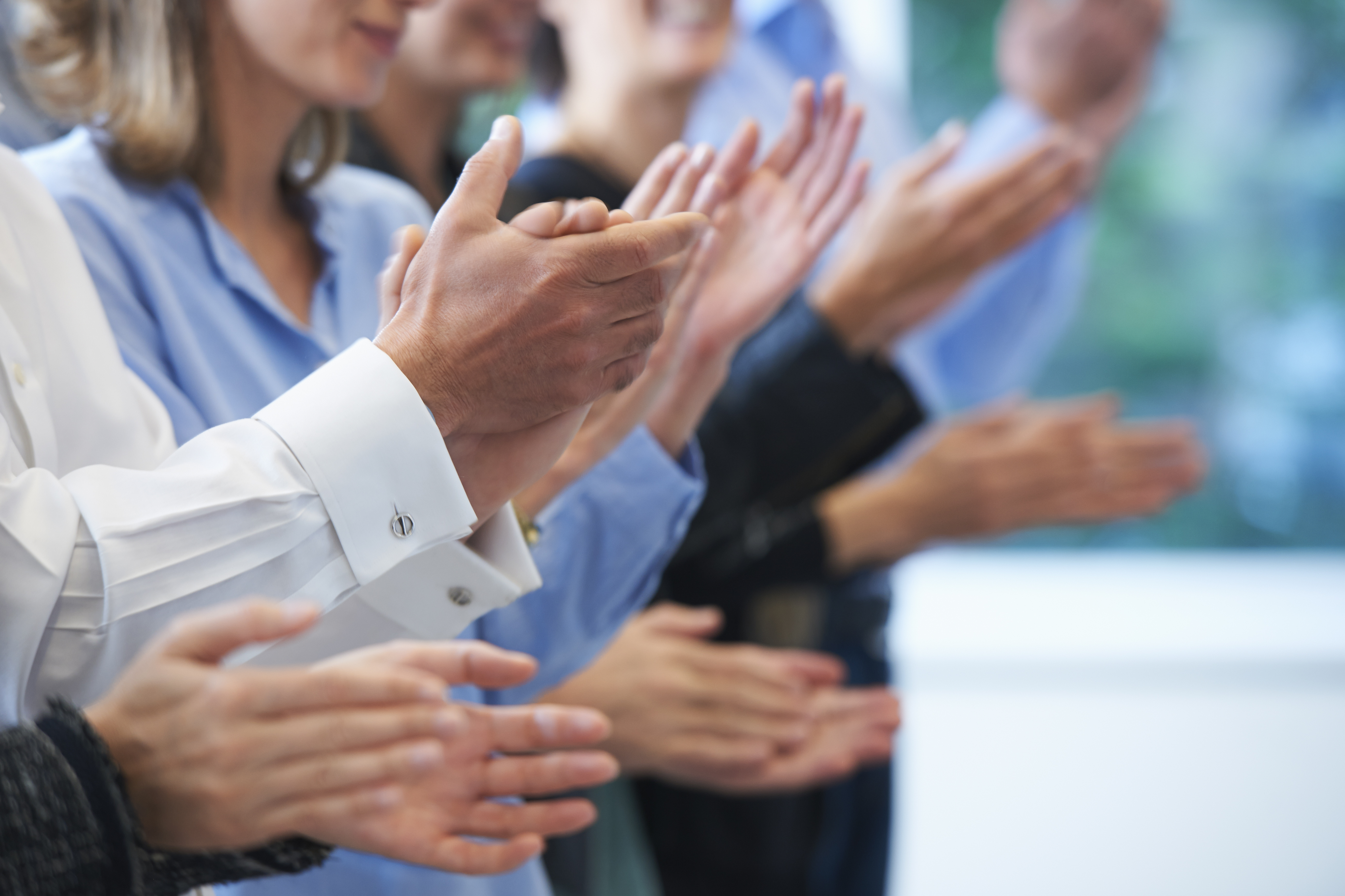 Cropped image of hands clapping