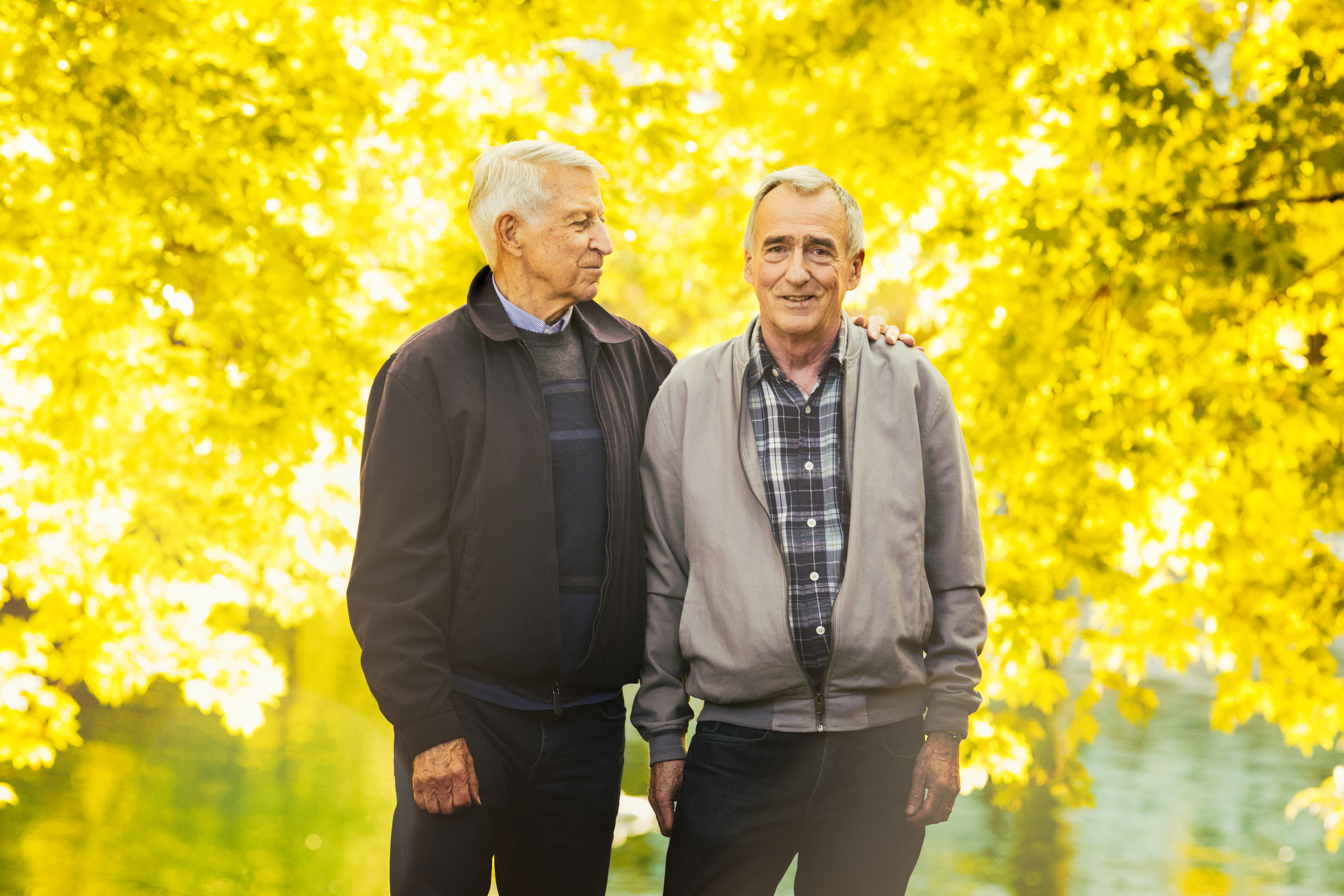 Senior gay couple Autumn portrait in park