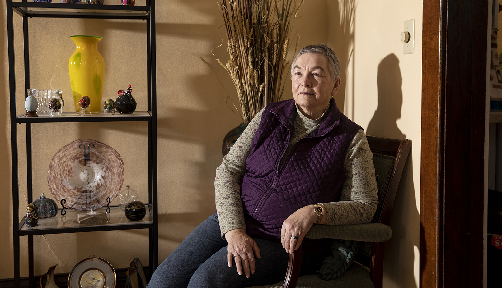 A woman sits in a chair