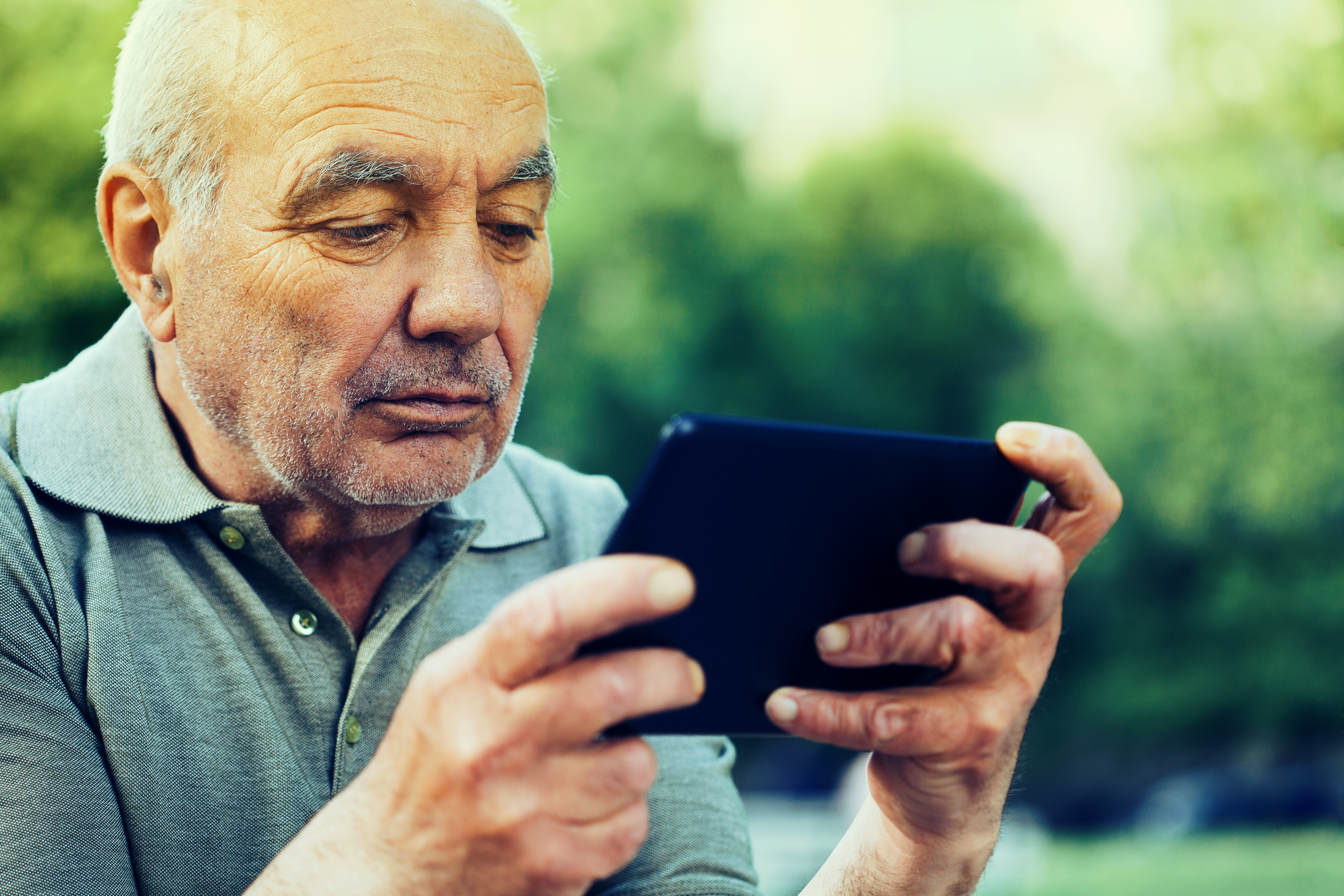 Senior man surfing the net