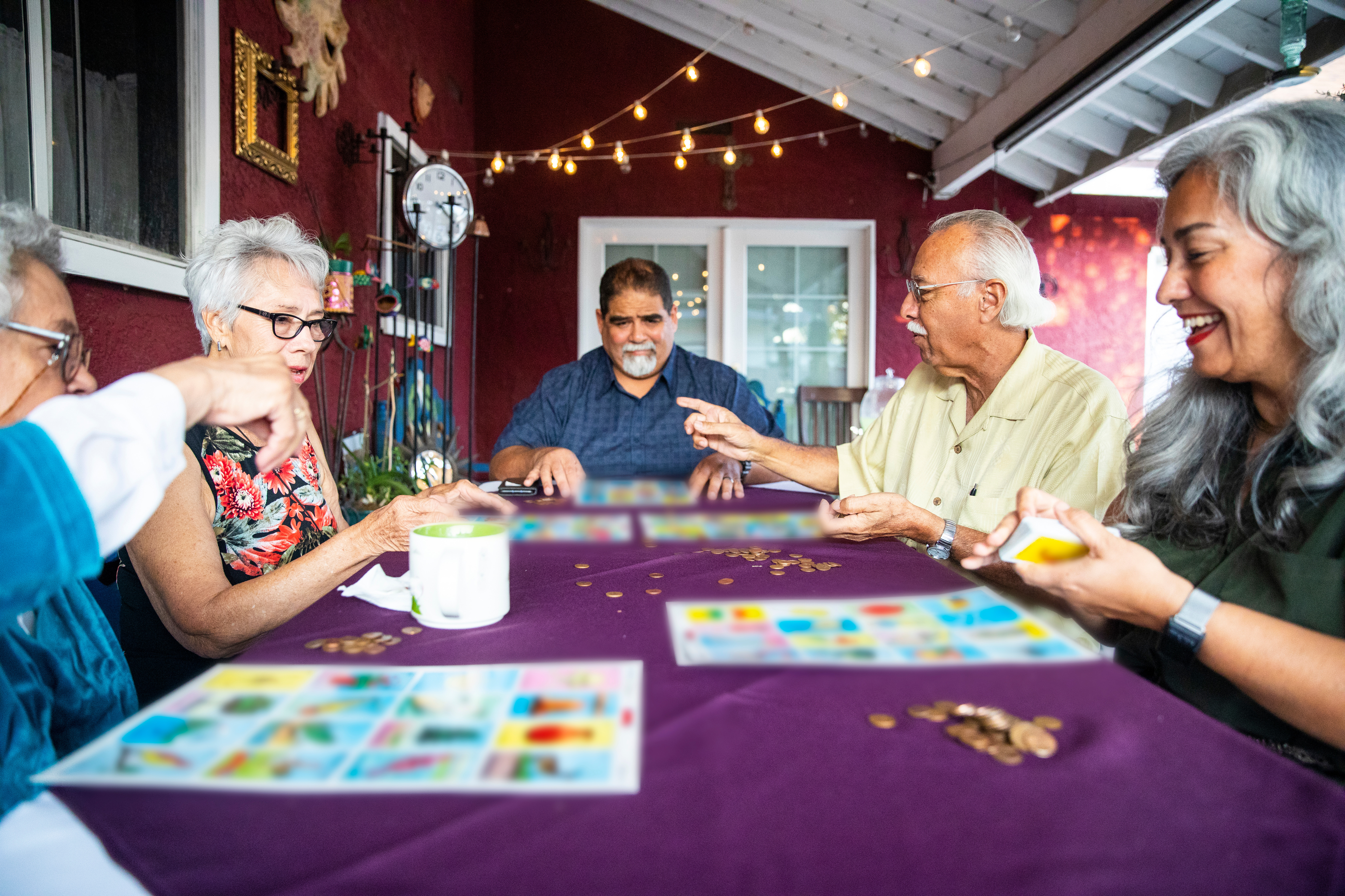 Mexican Family Playing A Game after Dinner