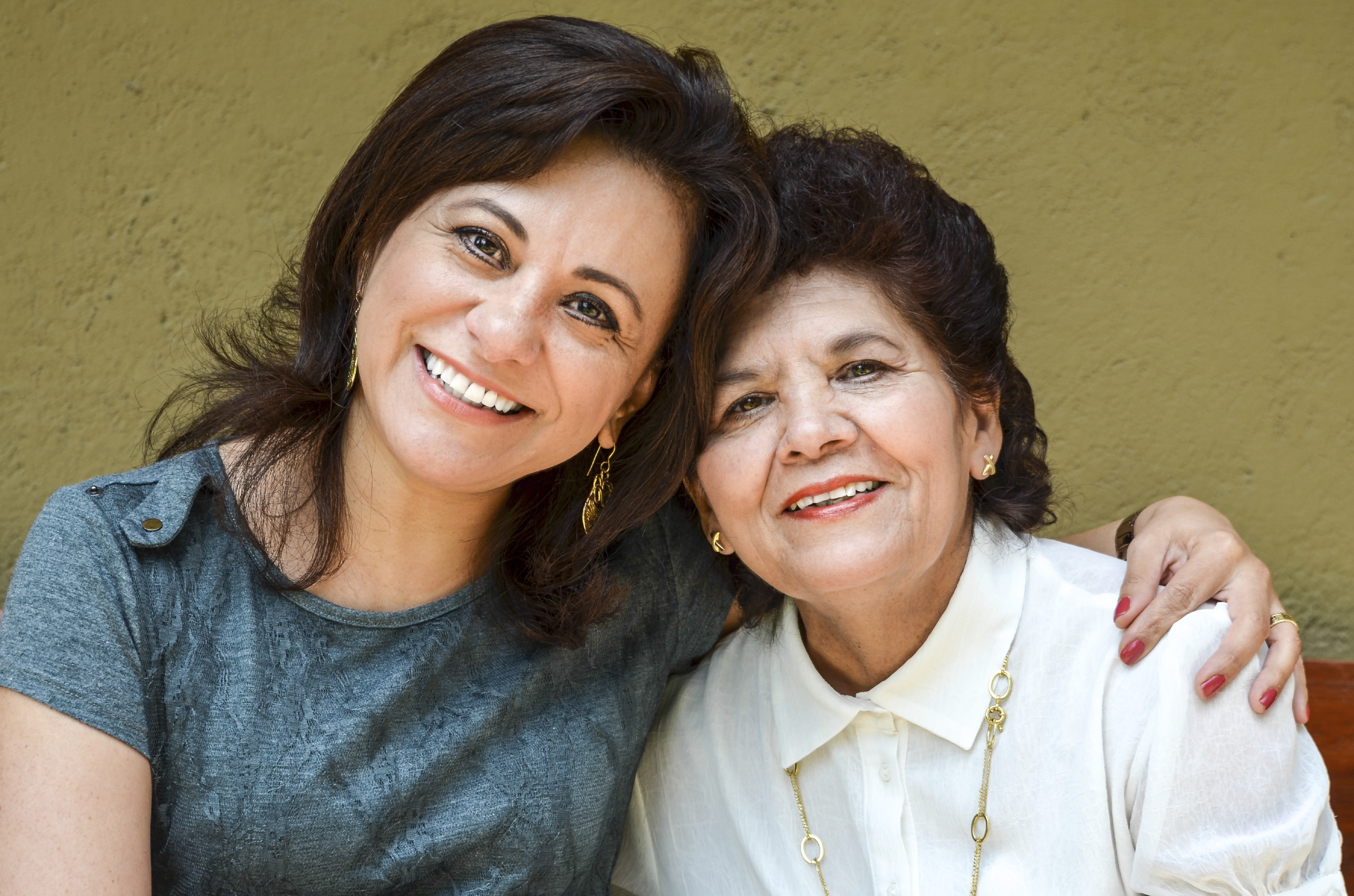 istock-caregiving-latino-mother-daughter-caregiver-hires-monainshanghai.jpg