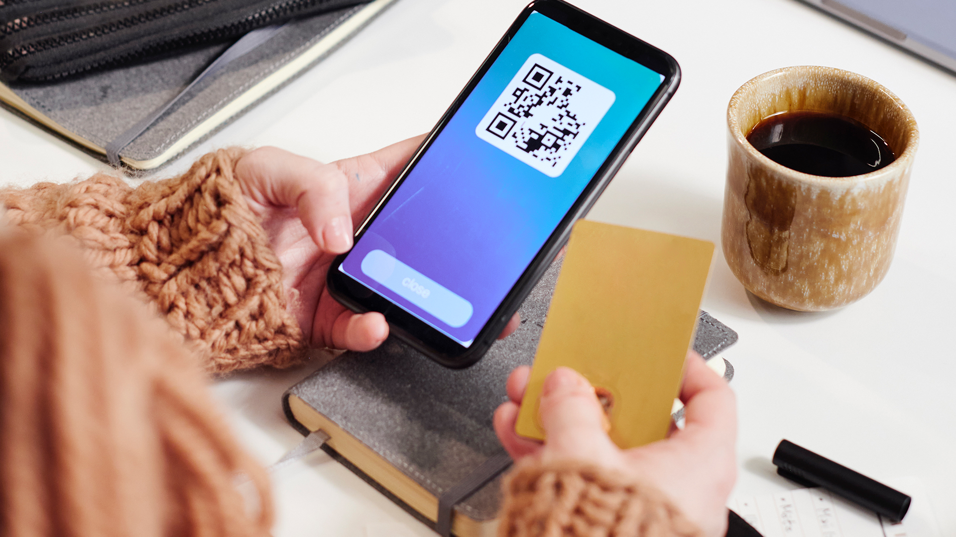 Woman scanning a QR code.