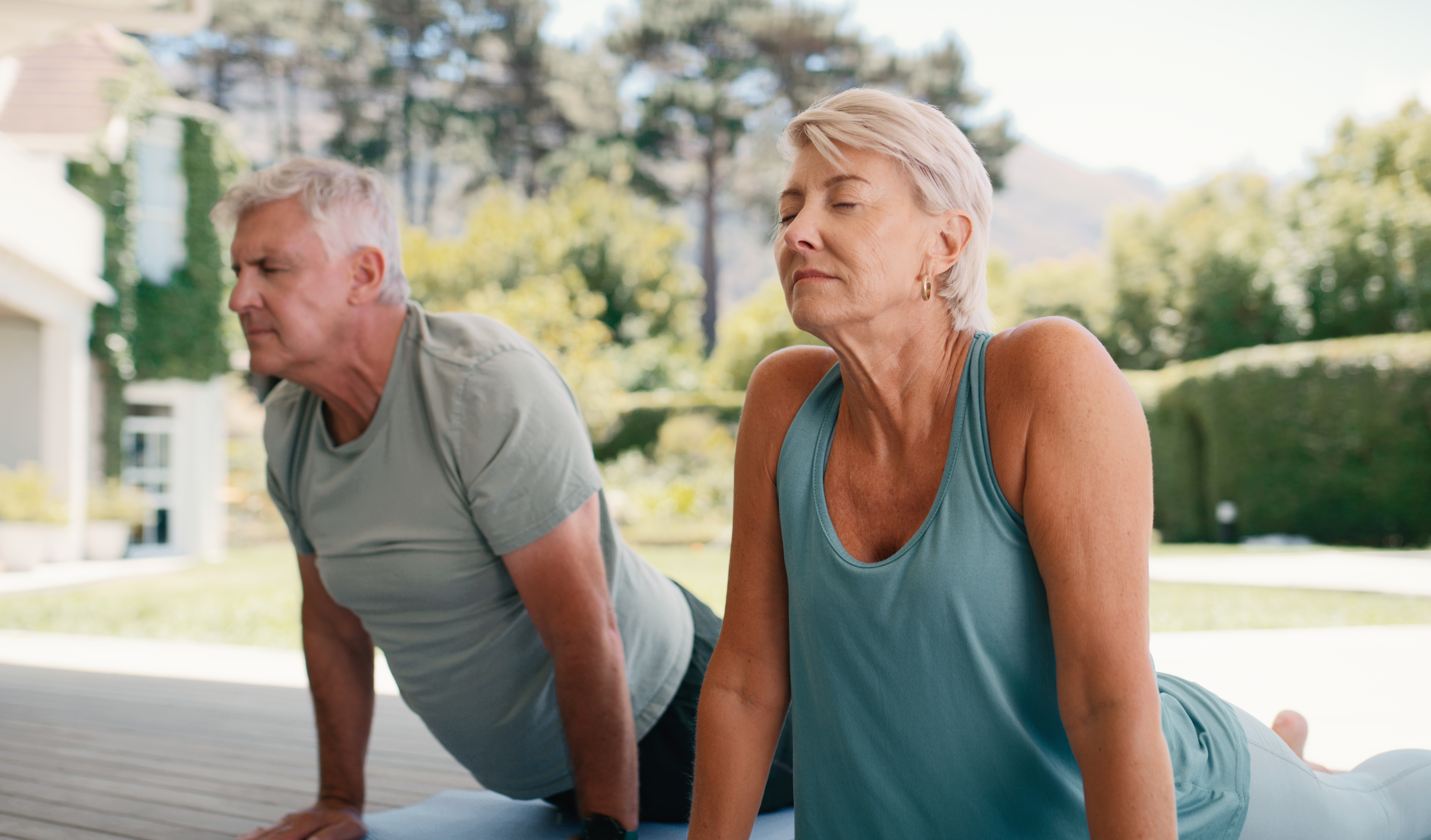 Fitness, stretching and relax with old couple and yoga for health, mobility exercise or balance. Wellness, longevity and mindfulness with senior man and woman in home for peace and low impact workout