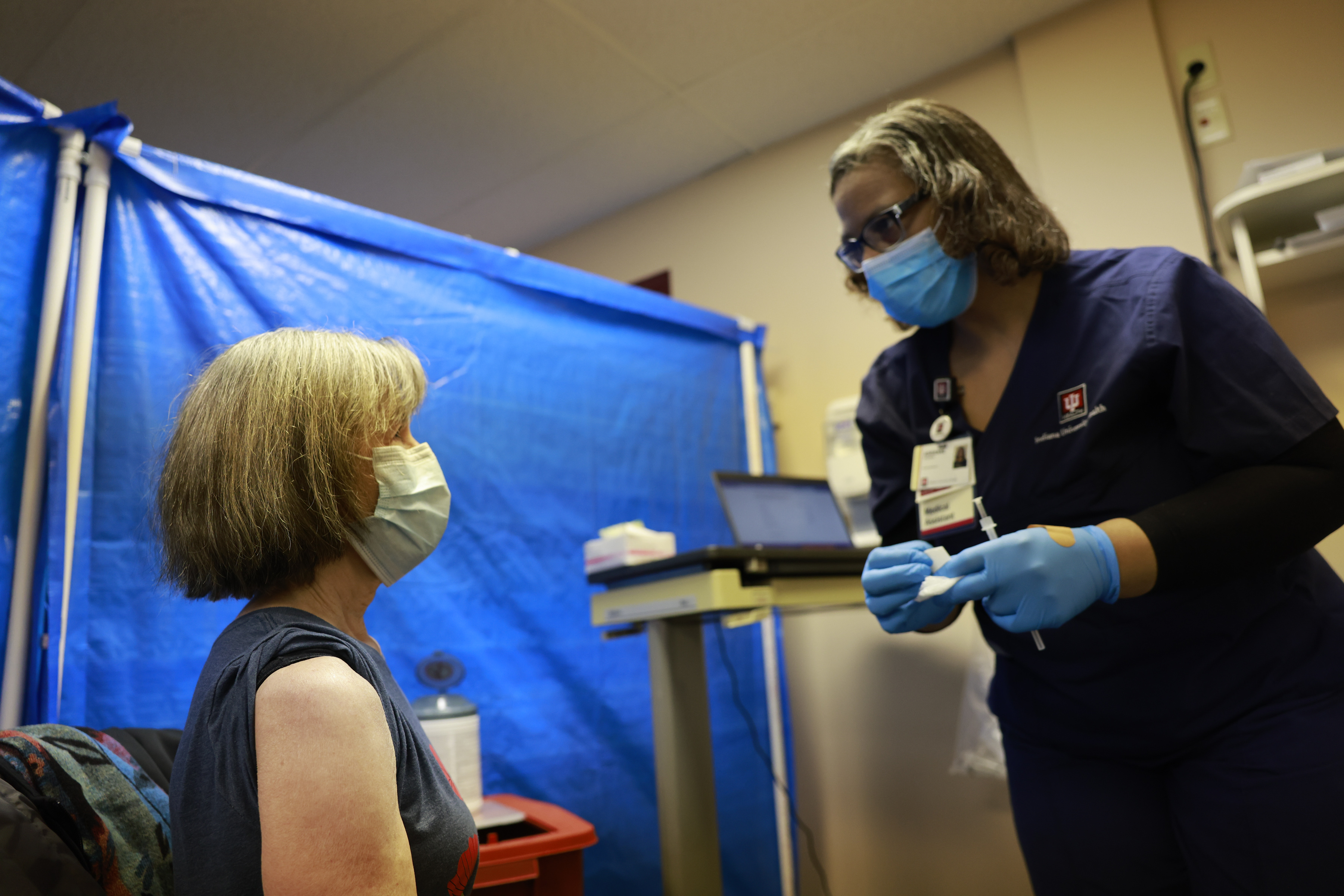 Medical assistant Adrienne Coleman talks to a patient who