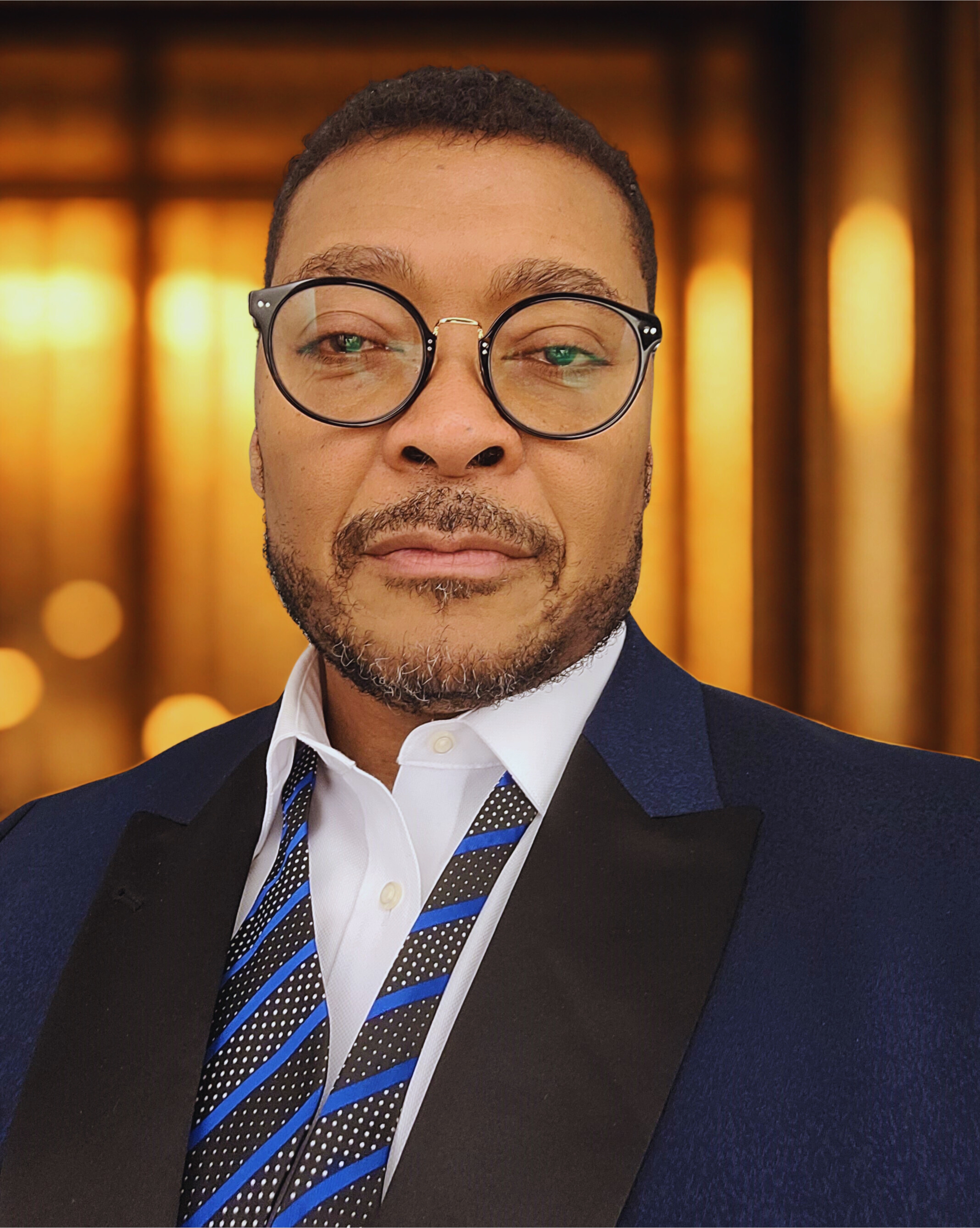 Adrion Headshot Casual w background.jpg