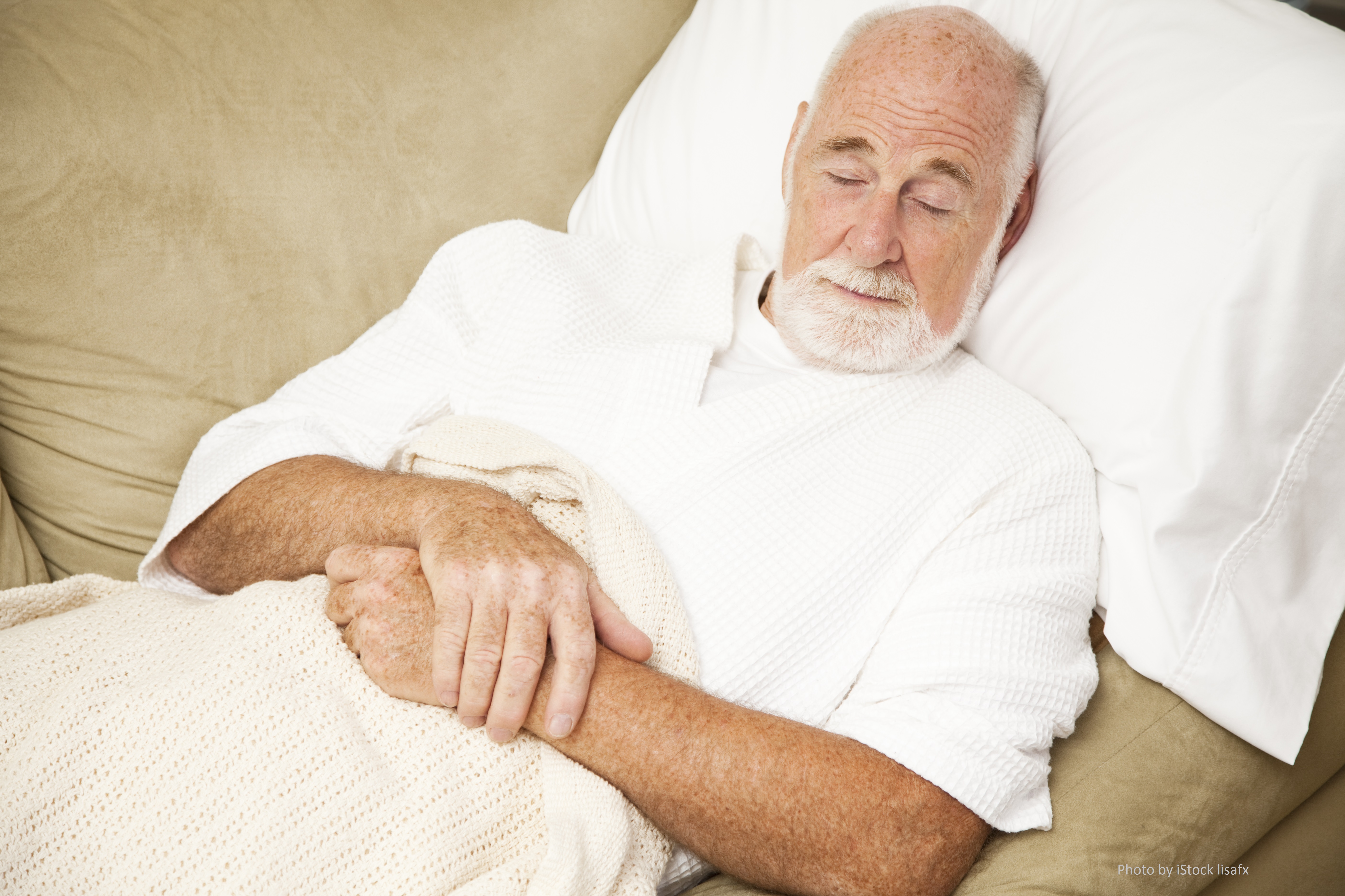 Senior Man Sleeps on Couch