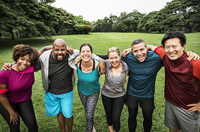 Group of cheerful diverse friends in the park