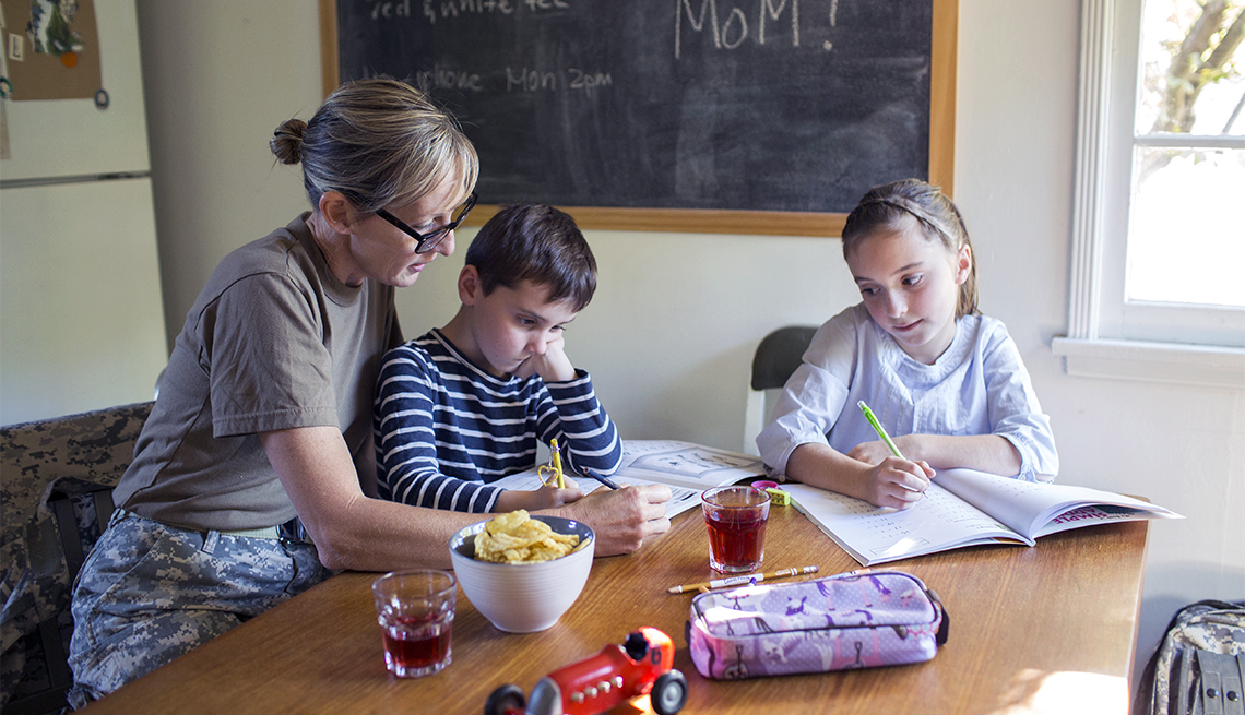 Military Mom helping her Children with Homework